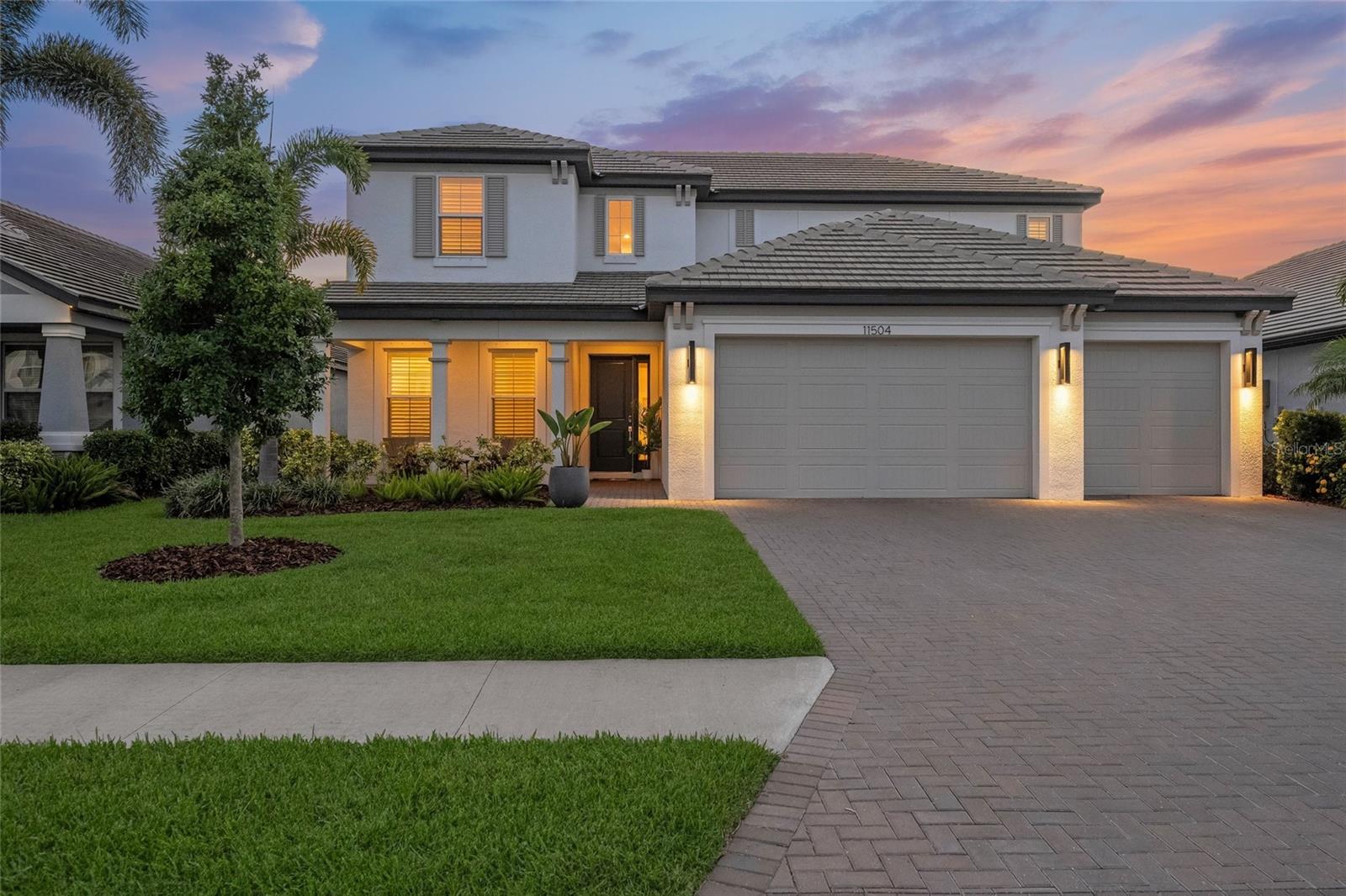 Extremely upgraded and modern, this spacious 5-bedroom, 4-bath home sits on a private preserve lot with a resident peacock, creating a setting that feels both elevated and memorable. Designed with high-end finishes, generous living spaces, and thoughtful details throughout, this home offers the kind of style, space, and privacy that stands out immediately.

Inside, the home is filled with elevated finishes and thoughtful upgrades, starting with a gourmet kitchen featuring a waterfall quartz island and quartz countertops, GE Cafe stainless appliances with range hood, gas cooktop, combination wall oven with convection and microwave technology, Kohler faucet package, single basin oversized undermount sink, custom walk-in pantry, soft-close drawers, and LED under-cabinet lighting. The primary suite offers a tray ceiling and custom walk-in closet, while the deluxe primary bath includes a rain shower head, dual vanities, an oversized step-in shower with built-in bench, quartz countertops, and a freestanding tub. All bathrooms include tile taken to the ceiling, upgraded wall-mounted mirrors, and upgraded light fixtures, with glass shower enclosure in the downstairs bath and tile accent walls in the primary bath, second bath downstairs, drop zone, and laundry room. Interior finishes include new engineered hardwood flooring, wood stairs, plantation shutters throughout, crown molding throughout, extensive custom millwork with oversized baseboards, wood door casings, applied panel molding, and wood-wrapped columns, plus a tongue-and-groove paneled accent wall in the dining room. Additional interior upgrades include high-end luxury chandeliers and pendant lighting throughout, ceiling fans in the bedrooms and loft, recessed lighting in every bedroom, a tray ceiling in the great room, 8-foot interior doors, and fresh interior and exterior paint. Outdoor and lanai features include a panoramic lanai screen, preserve lot with resident peacock, additional gas drop on the lanai, outdoor sink rough-in, holiday light package with electrical outlets in the soffit on either front corner of the home and on a timer in the garage, and a pavered driveway and lanai. Additional systems, storage, and smart home features include a gas tankless water heater, water filtration and softening system with soft-water loop, Safe Racks overhead garage ceiling storage, 60-amp electric vehicle charger, drop zone with custom cabinets, custom laundry room with plenty of additional storage, and a smart home package with doorbell camera, front and rear exterior cameras, and a wireless access point on the back lanai.

HOA fees include access to the community pool, playground, dog park, and pickleball courts. The location offers easy access to SR-64 and I-75, with Costco, shopping, dining, gyms, salons, and everyday conveniences nearby. Just a few blocks south are Lakewood Ranch schools including Gullett Elementary, Lakewood Ranch High School, and Mona Jain Middle School, along with LECOM and Manatee Technical College East Campus. You are also minutes from Downtown Lakewood Ranch, Waterside, SRQ International Airport, UTC shopping and dining, Ellenton Premium Outlets, and some of the top-rated beaches in the country.