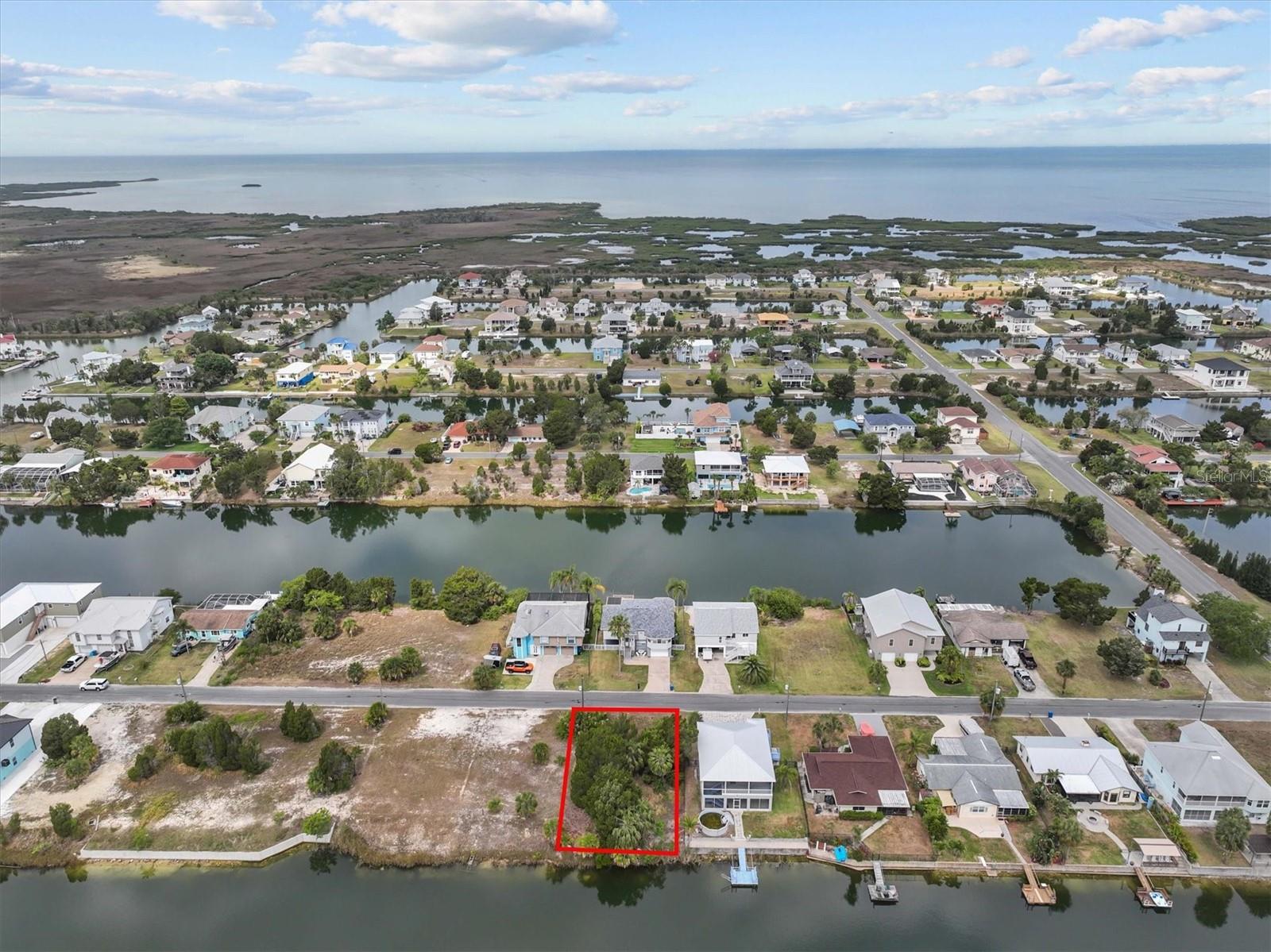 Waterfront Building Lot in Hernando Beach!

This 60 x 100 residential lot in the indirect Gulf access section of Hernando Beach is the perfect setting for your Gulf Coast fishing home! This lot has 60 feet on a spring fed freshwater canal. 

Located in a no-HOA community, this lot offers flexibility and freedom—use your future home as a short-term rental for income potential or simply enjoy the perks of coastal living with no deed restrictions! Store your boat, trailer, or commercial vehicle on-site and build up to 8-foot privacy fences, following county codes instead of HOA rules.

Boating Info: Indirect Gulf Access – To reach the Gulf, boats must go over a seawall boat lift and then pass under a fixed bridge at street level. Freshwater canal system – Water levels fluctuate with seasonal rainfall, not the tides.

Discover Hernando Beach – A Hidden Gulf Coast Gem - Tucked away along the Gulf of Mexico, Hernando Beach is a tranquil coastal hamlet with a vibrant boating and fishing community. Here, you'll find waterfront tiki bars, marinas, seafood markets, and fine dining, all adding to the area's unique charm. Unlike its name suggests, Hernando Beach doesn’t have a traditional sandy shoreline, but it more than makes up for it with unparalleled water access and a laid-back coastal vibe.

For anglers, Hernando Beach is a world-class fishing destination with inshore fishing for redfish, snook, and tarpon, plus offshore opportunities for grouper and snapper. The Weeki Wachee River, just 5 minutes away, offers a refreshing escape with swimming, paddleboarding, and kayaking in crystal-clear 74-degree spring water.

Convenient Location - Despite its secluded feel, Hernando Beach is less than 10 minutes from US-19, offering easy access to shopping, dining, hospitals, and entertainment. Tampa International Airport is just an hour away, and Disney is only 90 minutes from your doorstep!

Build your dream home in Hernando Beach, where the Gulf Coast lifestyle meets the convenience of modern living. Call today to learn more!