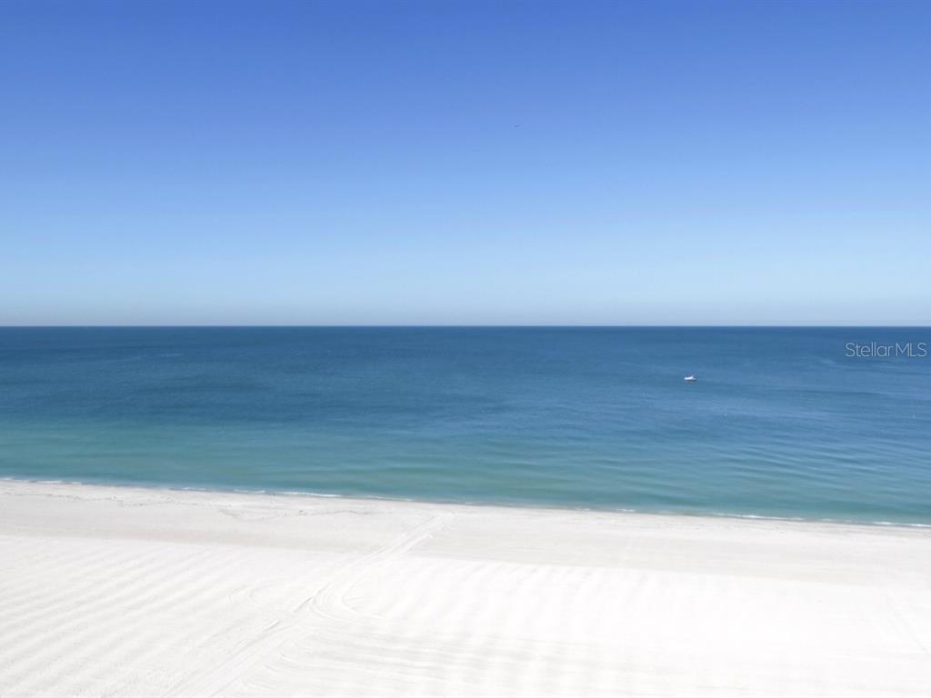 Direct Gulf, Beach, Clearwater Harbor & Sunset Front Nearly 5,000 Square Foot Penthouse Home Within the Iconic Modern Marvel That Is Utopia on Mid Sand Key Beach. Literally the floor through from Gulf to Bay with seamless sunrises to sunsets from no less than 7 balconies. Uninterrupted Elevator Access ascends directly into this spectacular residence, a 2 car garage and pool and beachfront cabana await a soon to be legendary Florida lifestyle. The appointments? Well, imagine a modern transitional yet warm environment for the sight and senses..An exquisite palette of stone flooring, custom nuanced Danish cabinetry, refined appliances, stone, wood and richly textiled and textured baths, profound closet built-ins and a panorama of legacy lighting. A sweeping double width family and great room open to a media room installation with integrated kitchen and breakfast area adjacent. The primary bedroom houses a spa bath and voluminous walk in closet, three more bedrooms follow- 2 of which are suites, and the 3rd serves as an office. As a boutique building the amenities are comprehensive inclusive of a state of the art gym, social room, seaside pool, and pool deck. The convenient Shoppes on Sand Key are less than a minutes walk, with their resort infused boardwalk. The recreationally significant Sand Key Park is 4 minutes walking distance. I await your visit, and look forward to our time together..