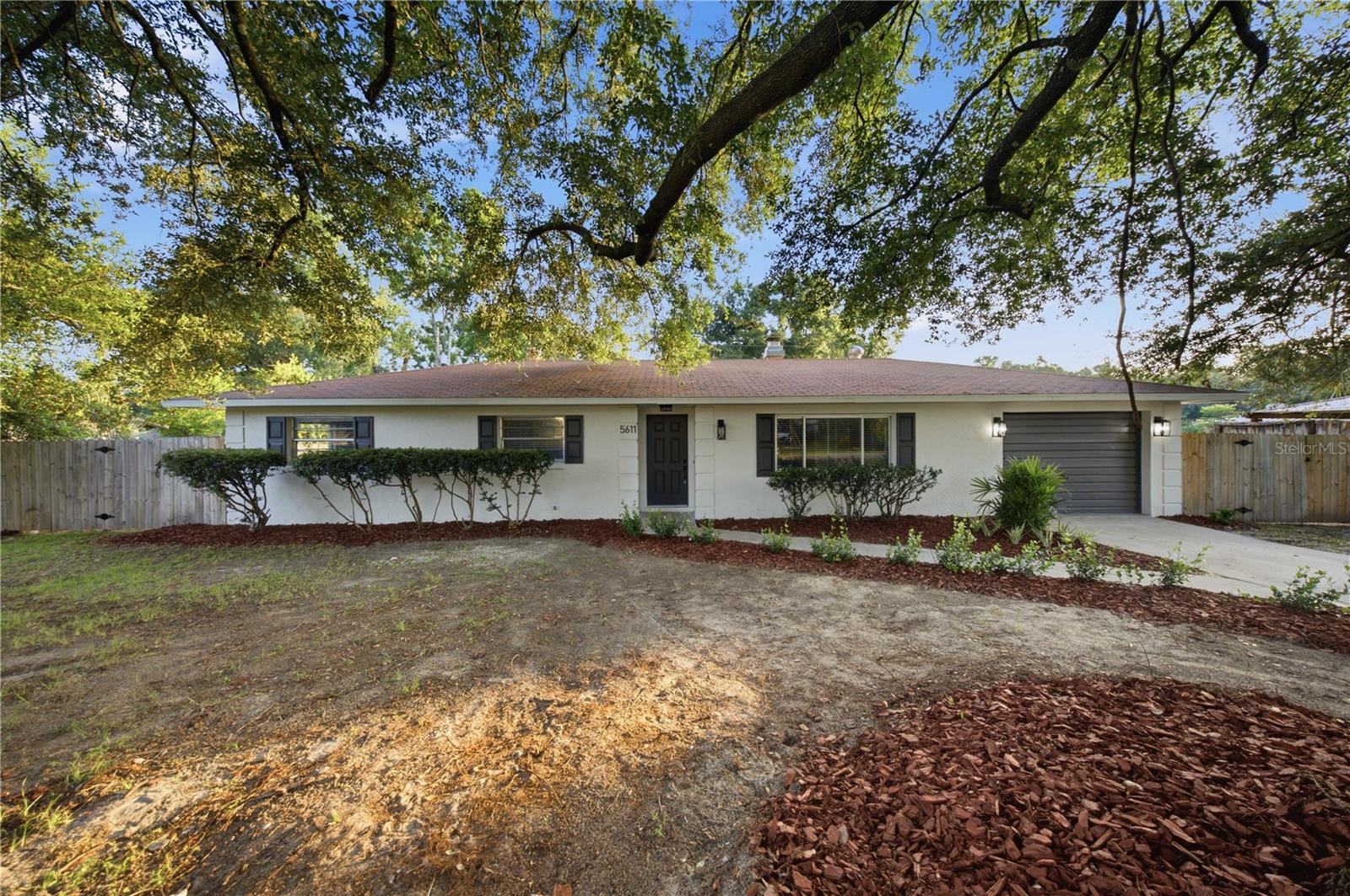 Fully renovated and thoughtfully refreshed, this single-level 3-bedroom, 2-bath 1 car garage and in ground POOL home with no HOA.  A grand live oak anchors the front, welcoming you to 0.23 acre lot lined with a concrete driveway to a custom mailbox and curb appeal. Inside clean and modern finish are found throughout, the home has been brought current down to the details: In the kitchen wood shaker cabinetry, all-new stainless steel appliances, luxury vinyl plank flooring throughout, and recessed lighting that keeps every room bright and intentional. Living room features wood burning fire place. The major systems carry the same story — a brand-new AC unit, new pool equipment, and a new water heater. A dedicated laundry space is plumbed with washer and dryer hookups in the garage. Out back, the property opens to an expansive backyard and a private pool, with a covered patio made for year-round Florida living. A one-car garage with an automatic opener completes the package. Set in an established Northeast Ocala neighborhood, the home is zoned for Marion County Public Schools — Ward-Highlands Elementary (K–5), Fort King Middle (6–8), and Vanguard High School (9–12).
Move-in ready, with the work already done. Schedule your showing today!