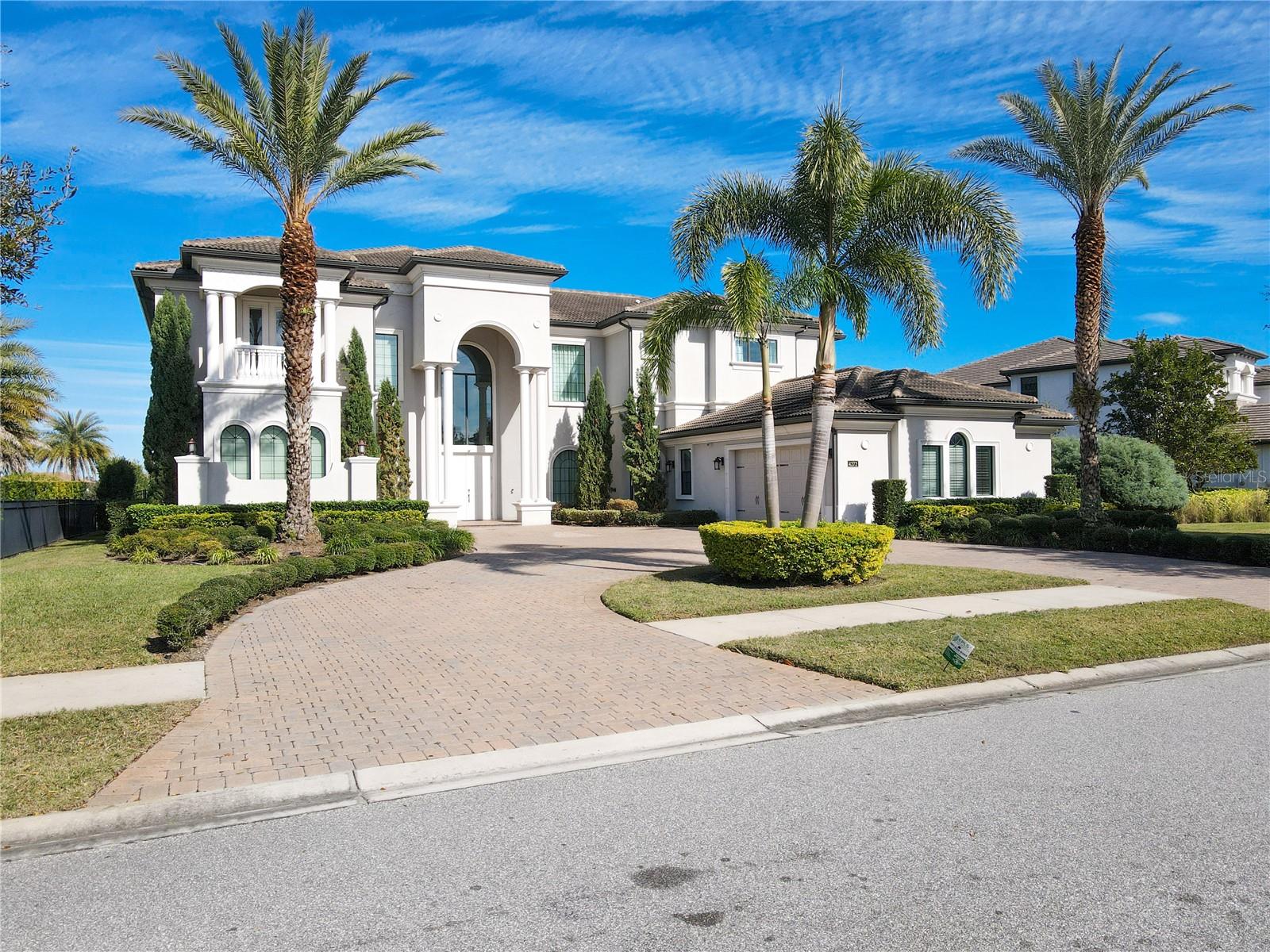 Welcome to CASABELLA at WINDERMERE the world of luxury!!!! Windermere voted one of the top 10 places to live in Florida! 
Once you enter this magnificent home you are sure to be impressed by the openness that the 24ft ceilings give you, with 2 story windows overlooking the tranquil beauty view of the enormous, heated pool/spa with infinity edge, overlooking the pond and fountain, it truly is your own outdoor oasis for entertaining friends and family or your own staycation! This stunning home boast over 6,800 Sq/Ft with 7 Bedrooms, 8 Full Bathrooms, a powder room and media room. All 5 family bedrooms are ensuite bedrooms and the 2 guest bedrooms has a Jack and Jill bathroom. The media room also has the uncommon amenity of a full bathroom as well. it truly is a feast for the eyes when you walk through the front door and you are welcomed by gorgeous views of the magnificent and modern formal living room overlooking all of the water views, from the huge infinity edge pool and spa to the pond/fountain.  Casabella is oh so perfectly situated in the heart of Windermere, a neighborhood very much known for its top-notch golf courses and "A" rated schools, located in very close proximity to renowned amusement parks with easy access to major highways, as well as an endless array of upscale dining, shopping and entertainment all at your fingertips. Room Feature: Linen Closet In Bath (Bedroom 2).