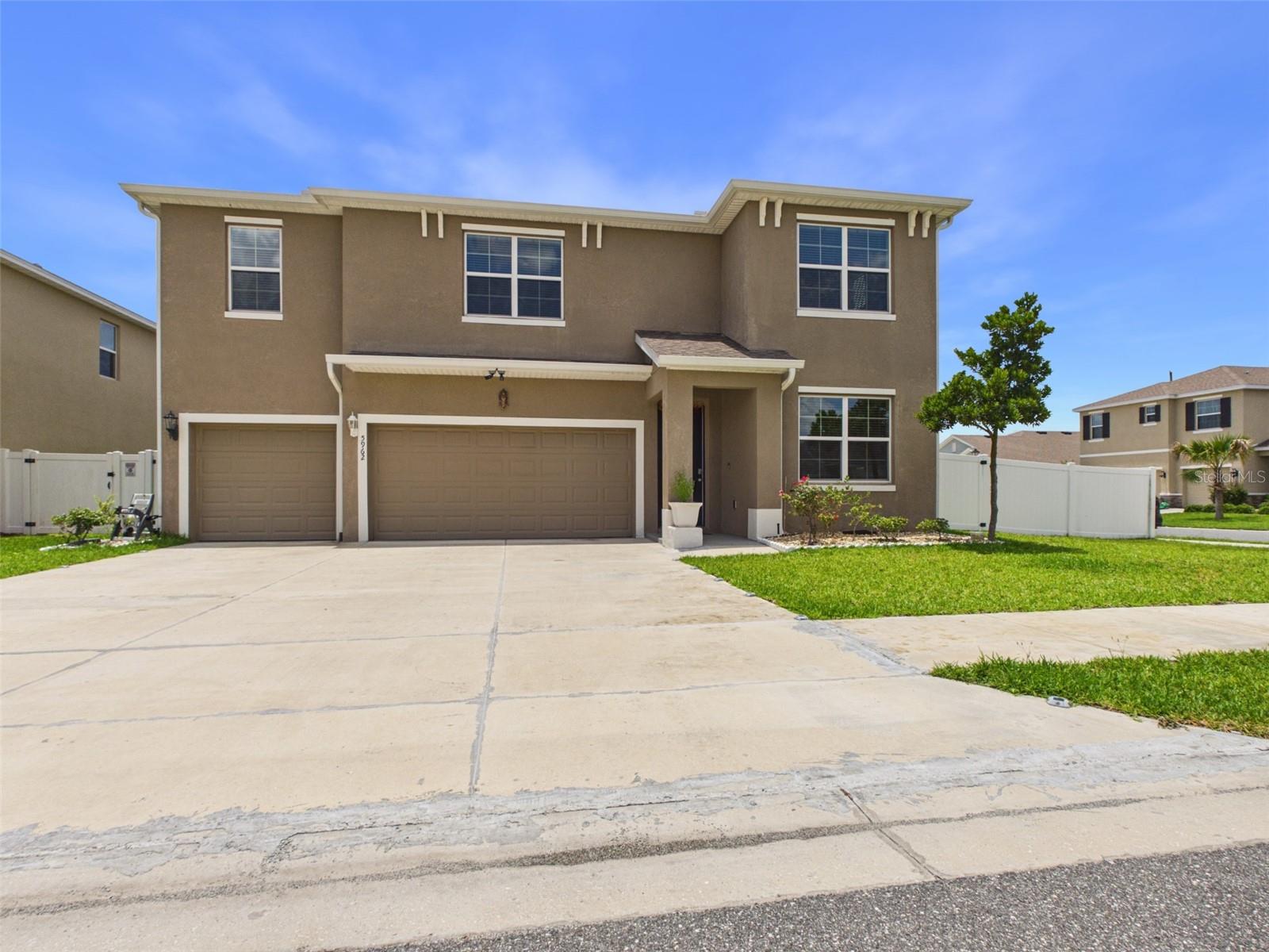 Welcome to the highly sought-after Torino model in Brookhaven! This beautifully upgraded two-story home offers 5 bedrooms, 4.5 bathrooms, and a spacious, thoughtfully designed floor plan with all-concrete block construction. Elegant chandeliers throughout the rooms and hallways add a touch of luxury and sophistication to the home.

Upon entry, you'll find a versatile flex space and a formal dining room, perfect for a home office, playroom, or additional entertaining area. The well-appointed kitchen features stone countertops, stainless steel appliances, ample cabinetry, a walk-in pantry, and a dinette area overlooking the expansive great room. The open-concept living space flows seamlessly to the covered lanai, creating the perfect indoor-outdoor lifestyle.

The first floor also includes a private guest suite and full bathroom, ideal for visitors or multigenerational living. Upstairs, the luxurious primary suite features dual walk-in closets and a spa-like ensuite bathroom with dual vanities, a soaking tub, and a separate shower. Three additional bedrooms, including one with its own ensuite bathroom, are situated around a large bonus living area, providing plenty of space for family and guests. For added convenience, the spacious laundry room offers two points of access, including direct access from the primary suite.

Notable upgrades include a secondary kitchen for added convenience, a partially paved backyard offering additional parking space, a professionally installed security system, and a fully fenced backyard. Combining space, functionality, and modern upgrades, this exceptional home is ready to impress.

The Brookhaven community offers modern, energy-efficient homes in the perfect setting for a balanced and high-quality lifestyle. Residents enjoy access to a community pool that is especially inviting on hot summer days,  neighborhood playground. Conveniently located just 2 miles from Jasmine Square, you'll have easy access to shopping, retail stores, and a pharmacy. Supermarkets, medical offices, dining, and other everyday conveniences are located less than 5 miles away. Also within 5 miles, the new BJ's Wholesale Club is planned to open, adding even more shopping convenience and value to the area. This home offers an exceptional combination of comfort, convenience, luxury, and community amenities.