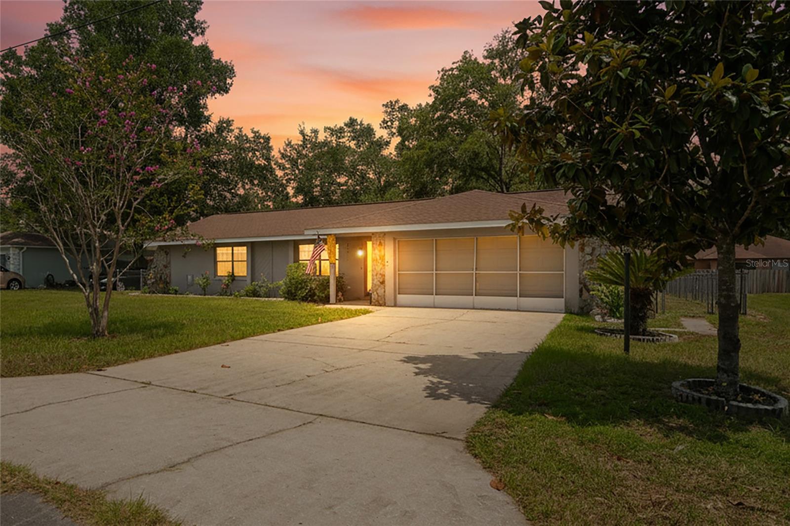 If you have been waiting for the right home at the right price, this could be it. This beautiful home offers over 1,200 sq. ft. of living space, featuring two bedrooms, two full bathrooms, and an oversized two-car garage. equipped with screens. The property is located in a no-HOA community and a non-flood zone. It features a chain-link fenced backyard, an air-conditioned and heated glass-enclosed sunroom, and an additional screened-in patio. Inside, the open-concept layout includes spacious living and dining areas perfect for everyday living or entertaining. The kitchen provides ample cabinet space and a breakfast bar that overlooks the main living area. The garage screens are specifically designed to let in the breeze while keeping pests out, making the garage an ideal space for a workshop, gym, or additional living area. Conveniently located near shopping, restaurants, schools, and parks, the home also offers easy access to the Withlacoochee State Trail and a simple commute to Crystal River, Dunnellon, and the Gulf Coast. Schedule your showing Today because this one is Priced to Sell.