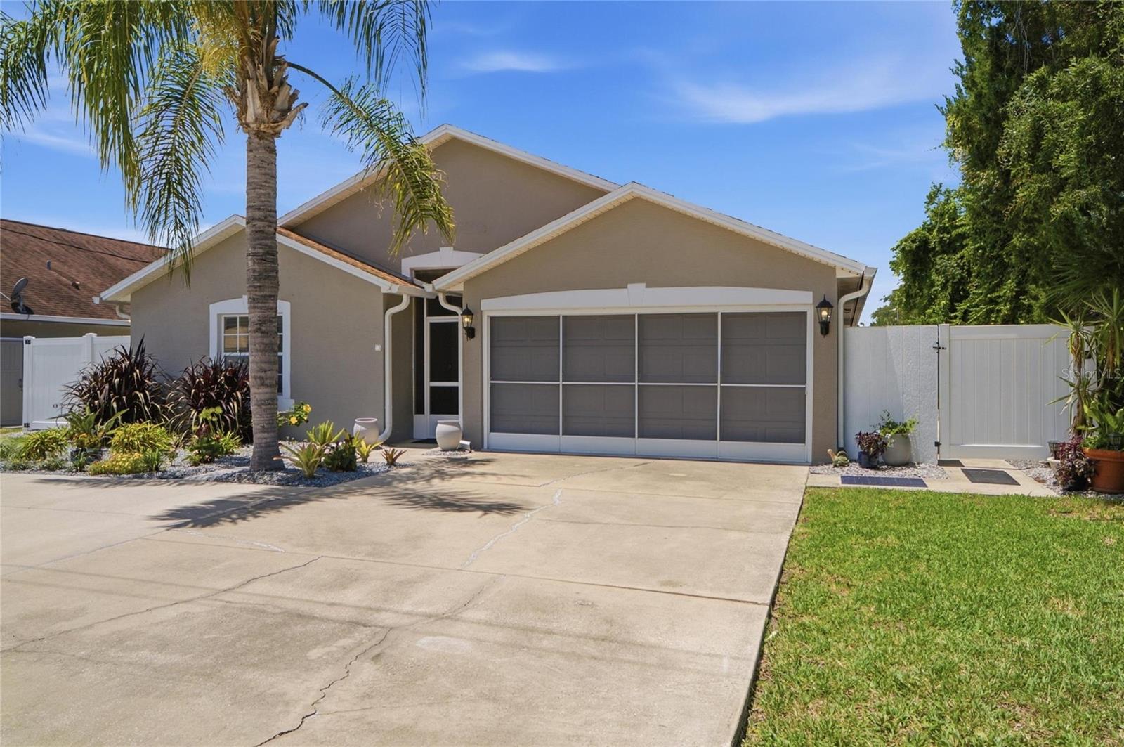 Beaches within Reaches Realty welcomes you to your waterfront dream home capturing the true essence and meaning of Florida Living! Nestled on a saltwater canal with direct access to the Intracoastal waterway, this beautifully maintained saltwater pool home offers the ultimate coastal lifestyle in Flagler County. Boating enthusiasts will appreciate the covered boathouse, private boat lift, and expansive waterfront dock, making it easy to spend days on the water. A few steps up from the boathouse is your private backyard oasis featuring a resort style pool, spacious paver deck, and an impressive outdoor kitchen and entertaining area perfect for hosting family and friends with multiple seating areas designed for year- round enjoyment. Whether enjoying a sunset dinner, relaxing poolside, or launching your boat for a day on the intracoastal, every detail of this property is designed for waterfront living. Inside, the home offers comfortable living spaces with large windows that bring in natural light and showcase the beautiful open layout and outdoor setting. With the stunning updates shown, i'd position this home as a fully updated waterfront retreat that combines luxury indoor living with exceptional outdoor amenities. From the moment you step inside, you'll appreciate the bright, open-concept floor plan featuring soaring vaulted ceilings, luxury vinyl plank flooring, abundant natural light, and breathtaking views of the pool and waterfront beyond. The heart of the home is the stunning designer kitchen, showcasing custom white cabinetry, quartz countertops, subway title backsplash, and an oversized center island perfect for entertaining family and guests. The spacious living and dining areas flow seamlessly together, creating an inviting space for everyday living and memorable gatherings. The newly remodeled primary bathroom is a true showpiece, featuring a stunning custom walk-in shower with floor to ceiling designer title, decorative stone accent wall, pebble-stone shower flooring, frameless glass enclosure, and a convenient low-threshold entry for ease of access.  It boasts a whole house wired generator system for peace of mind during storm season and added circle driveway providing abundant parking for guests, recreational vehicles or multiple cars.  This house has too much to list so we welcome you to book a showing or come meet me at one of our Open Houses. We look forward to welcoming you in and working with you to make this home your next forever home!