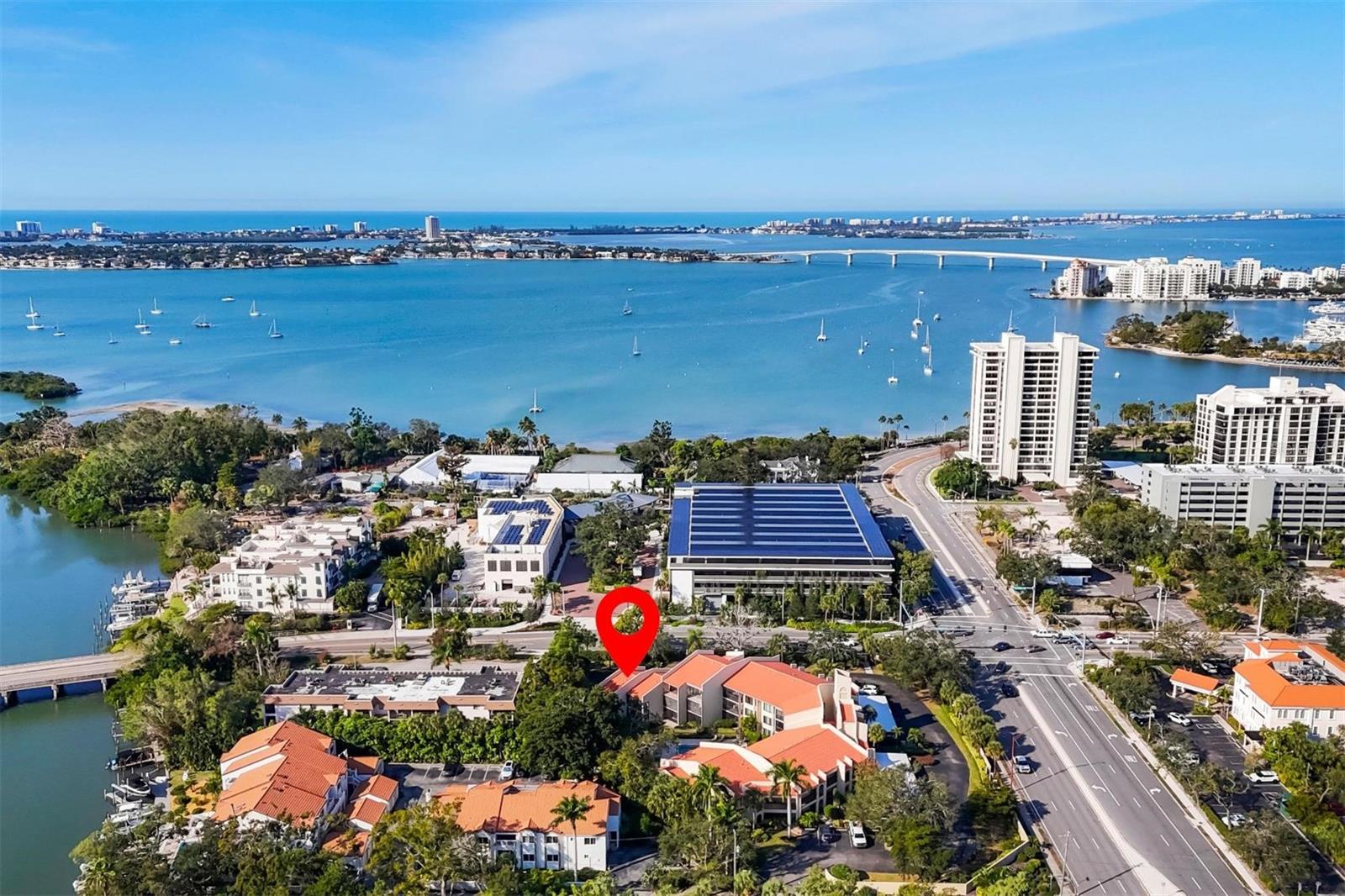 Unbeatable value and location in downtown Sarasota. This 3-bedroom, 3 full bath residence lives more like a townhome than a condo. No elevators, park right in front of your front door and walk out to the pool. Ideally located across from Selby Gardens and only one block from Sarasota Bay. Hudson Harbour is not in the AE flood zone, has covered parking and is pet-friendly, allowing one small dog and multiple cats. The three versatile bedrooms in this residence provide exceptional flexibility. The first-floor bedroom & bath can serve as a convenient primary suite, while the second-floor option offers additional privacy—ideal for guests, family, hobbies, or a home office. Enjoy two private balcony lanais overlooking a lush tropical garden and tranquil fountain, creating the perfect setting for morning coffee or relaxing evenings. Inside, the home features light soft neutral tones complemented by neutral tile flooring and elegant crown molding throughout. The thoughtfully designed kitchen includes a spacious eat-in dining area and breakfast bar that opens seamlessly to the living and dining spaces—perfect for everyday living and entertaining. Numerous updates have been completed over the years, including: Brand-new AC (2024), New windows and sliding glass doors, renovated bathrooms, updated kitchen appliances, New washer and dryer, Water heater replacement and fresh interior paint. Hudson Harbour offers a private downtown, intimate tropical setting with only 18 units centered around a heated community pool. Living here places you within walking distance to the Sarasota Bayfront Park for nightly sunsets, a boat cruise or waterfront dining and of course all of Sarasota’s downtown restaurant and theater options. Outdoor lovers will appreciate easy access to Legacy Trail, Payne Park and Lido Beach. Take the free downtown trolley to St. Armands Circle and Lido Beach. Schedule a showing and don’t miss this best priced Downtown Sarasota residence on the market today !