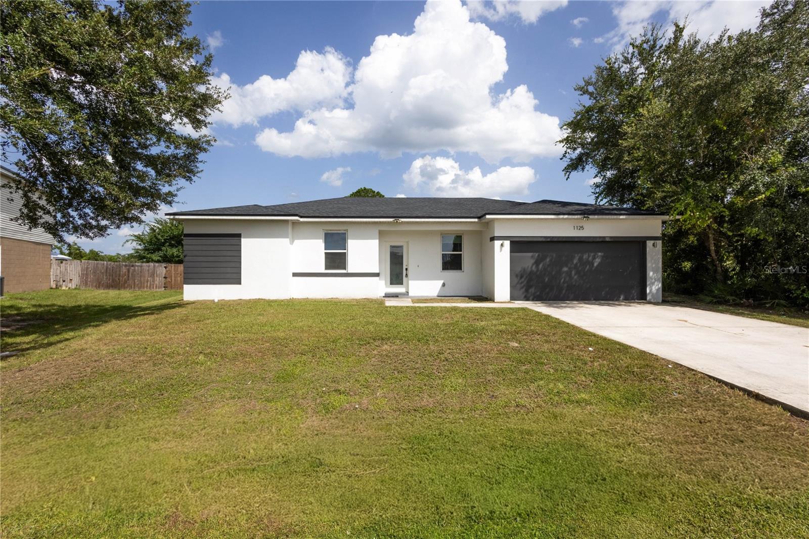 Beautiful move-in ready home built in 2021, offering all the benefits of newer construction without the new construction price tag! 
Why wait months for a new build when you can move right into this beautifully maintained 4-bedroom, 2-bathroom home offering over 2,000 square feet of thoughtfully designed living space? From the moment you walk in, you'll love the bright open-concept floor plan filled with natural light, perfect for both everyday living and entertaining. The spacious kitchen features granite countertops, stainless steel appliances, abundant cabinetry, a large center island with bar seating, and overlooks the living and dining areas. 
The private primary suite offers a spacious walk-in closet, dual vanities, and a walk-in shower, while three additional bedrooms provide plenty of space for family, guests, or a home office. Step outside to a generously sized backyard with endless possibilities for entertaining, pets, or creating your dream outdoor oasis. Located in one of Central Florida's fastest-growing communities, you'll enjoy convenient access to the Poinciana Parkway, shopping, restaurants, schools, parks, medical facilities, and are within easy driving distance to ChampionsGate, Walt Disney World, and all that the Orlando area has to offer. Enjoy the added value of a low HOA of approximately $23 per month while benefiting from newer construction with a newer roof, HVAC, plumbing, and electrical systems. Best of all, this home is vacant, move-in ready, and easy to show. 
Don't miss your opportunity to own a practically new home at an exceptional value. Schedule your private showing today before it's gone!