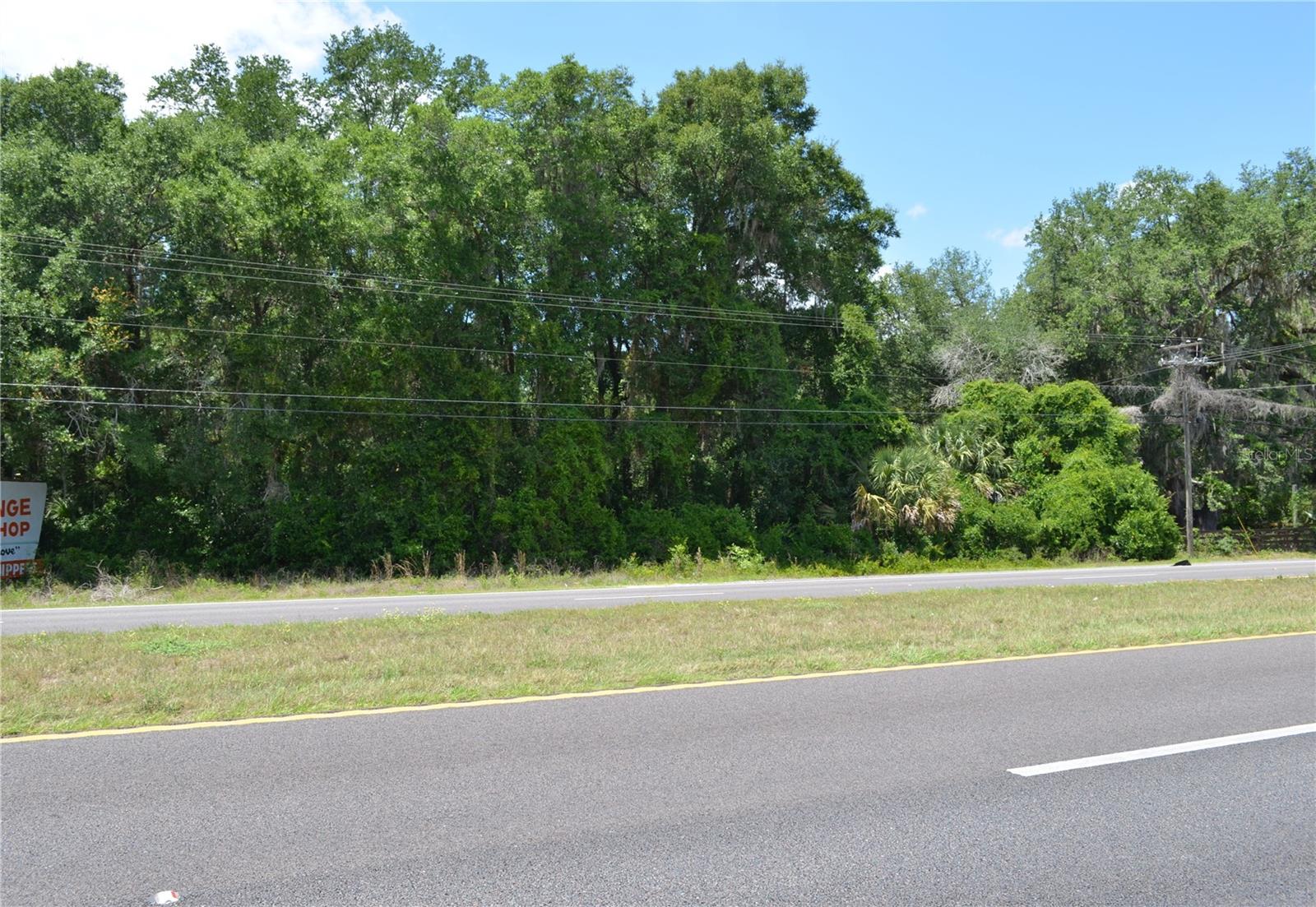 High-visibility 3.01-acre commercial site located directly on Hwy 301 in Citra with approximately 16,000 vehicles passing daily. This property offers excellent exposure for retail, service, or commercial development. The front portion is zoned B-4 Regional Business with A-1 zoning on the rear, providing flexibility for a variety of uses. The land features approximately 173 feet of frontage and deep dimensions up to 750 feet, offering ample space for building, parking, and future expansion. Classified as vacant commercial land with no existing structures and located in FEMA Zone X. Positioned within Citra Commerce Center with convenient access to major corridors and surrounding growth.