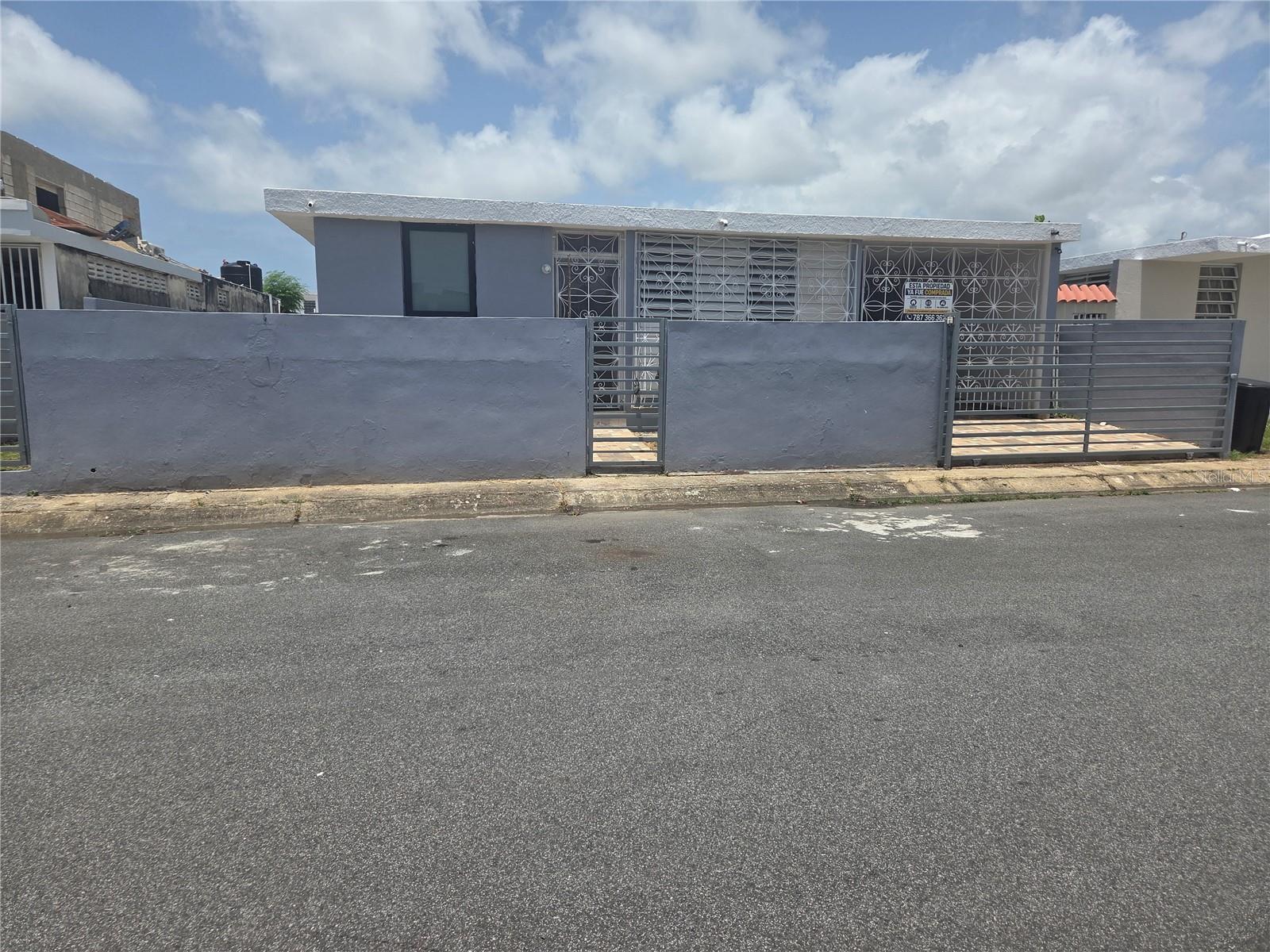 A comfortable 4-bedroom, 2-bathroom home, perfect for those seeking a prime location. The property features a two-car garage, a spacious kitchen, and a large backyard. It is situated near the town center, offering easy access to hospitals, shopping centers, schools, supermarkets, and essential services. Located just 15 minutes (approximately) from the airport and beaches, it is an excellent choice for either a primary residence or an investment property. Move-in ready and located in a convenient, central area. Don't miss the chance to make it yours! Recently appraised at $246,000.