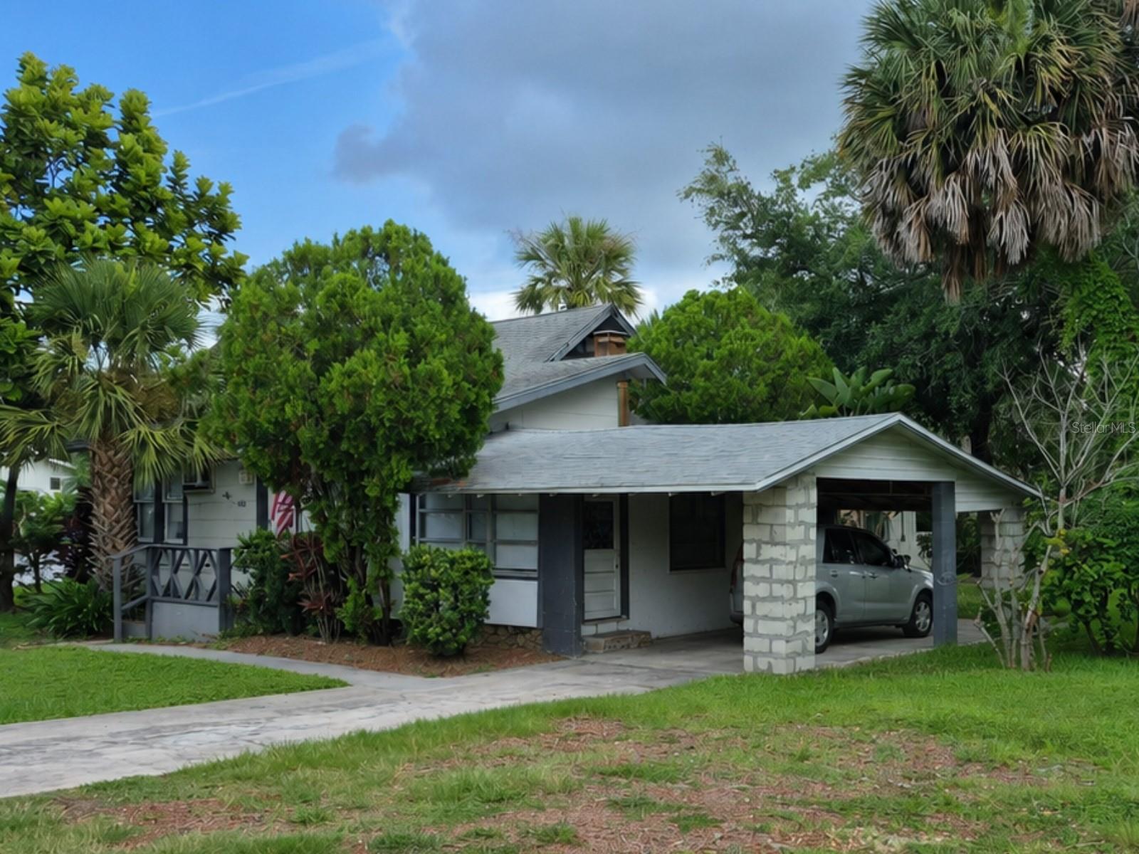 Virtually Staged. Rare riverfront opportunity in the heart of downtown New Port Richey. Built in 1928 and situated on just under half an acre along the Pithlachascotee, or “Cotee,” River, this two-story home offers over 1,800 square feet of living area and a setting that is difficult to duplicate. Located just off Main Street and across the river from Sims Park, the property combines downtown convenience, river frontage, and historic character in one unique package.

Over the years, the home has been divided into three separate living spaces. The front portion offers a charming one-bedroom, one-bath unit of just under 700 square feet, including a dining room. The rear portion includes a two-bedroom, one-and-a-half-bath layout with a large kitchen/dining area and living room. Upstairs is an efficiency-style space of about 200 square feet with a full bath and potential access from either inside or outside the home and could be a great in-law suite.

This property is not a finished showpiece—it is an opportunity. The front unit is in nice condition, the rear unit is ready for some updating, and the second floor will require complete renovation. For the right buyer, however, the possibilities are significant. Continue with a multi-space layout, explore income-producing potential, or bring the home back together as a single riverfront residence with an early New Port Richey period feel or wipe the slate clean and build your dream home!

The lot includes approximately 90 feet of river frontage with a concrete seawall, offering a natural place to explore the possibility of adding a dock and creating a place to tie up your boat, subject to permitting and approval. Whether your vision is restoration, investment, or a distinctive downtown riverfront home, this property offers the kind of setting, history, and potential that rarely comes available.