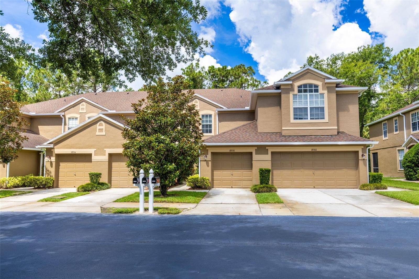 Welcome home to this beautifully updated 2-bedroom, 2.5-bath townhome located in the highly sought-after New Tampa area (33647)! Nestled within a gated community, this move-in-ready home offers the perfect combination of style, comfort, and convenience.  Step inside to find an inviting open-concept floor plan featuring no carpet throughout, creating a clean, modern look that's easy to maintain. The spacious kitchen boasts granite countertops, ample cabinetry, and flows seamlessly into the living room—perfect for everyday living and entertaining. Upstairs, the thoughtfully designed split-bedroom layout provides privacy, with each bedroom featuring its own bathroom. The bathrooms have been tastefully upgraded, and the home's charming décor creates a warm and welcoming atmosphere throughout.  Enjoy your morning coffee or unwind after a long day on the screened lanai, where you'll appreciate the peaceful preserve views and relaxing natural setting. Residents enjoy access to the community pool within the townhome neighborhood, plus the larger master community amenities including a pool, fitness center, playground, and more. Conveniently located near top-rated schools, shopping, dining, parks, golf courses, and major highways, this home offers everything you need to enjoy the Florida lifestyle. This charming townhome is the perfect place to call home!