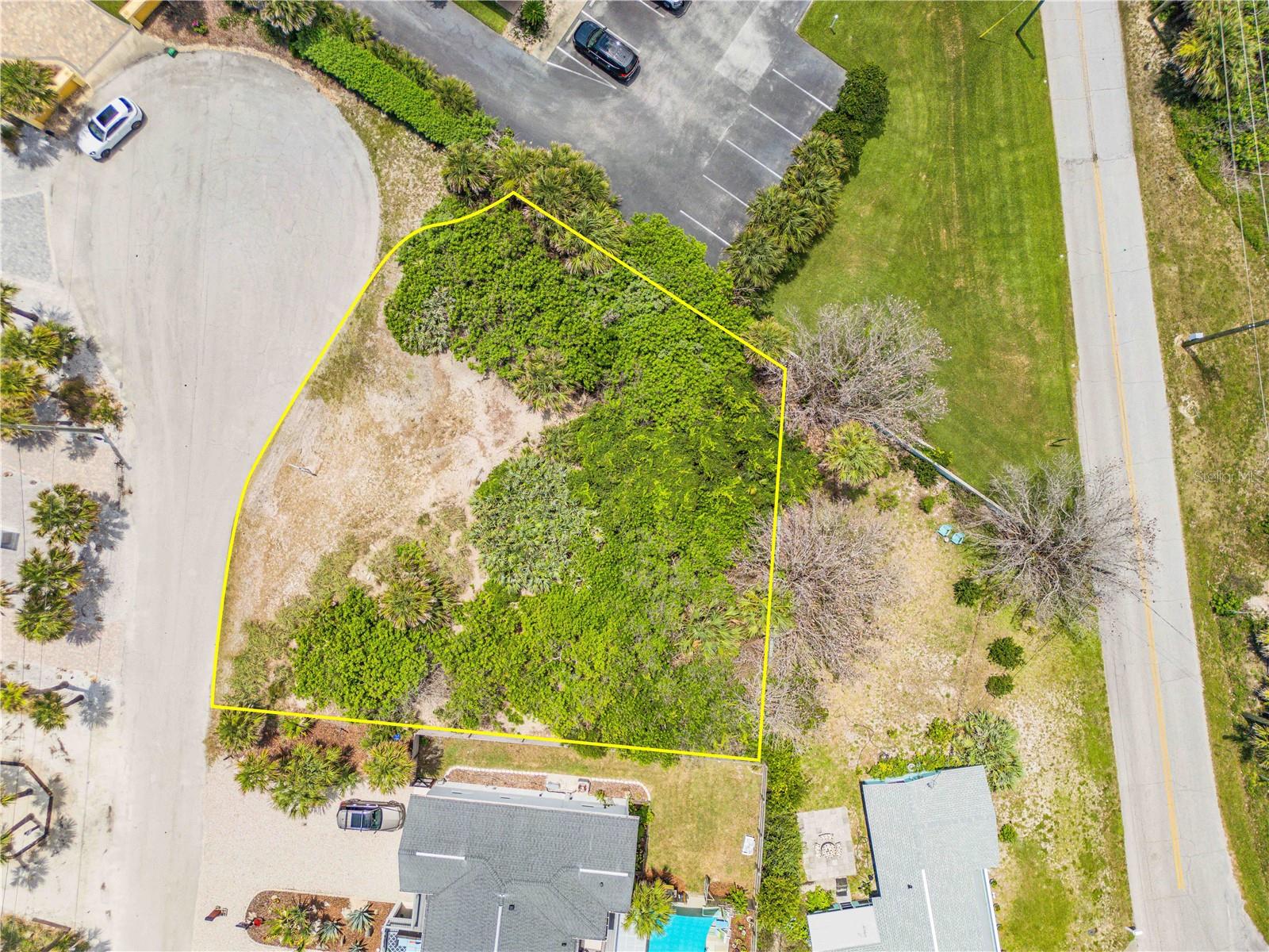 Virtually Staged. Rare beachside opportunity on one of New Smyrna Beach’s most desired streets. Located at 4732 Van Kleeck Drive, this vacant parcel sits at the southern end of Van Kleeck Drive and offers over 12,000 square feet to bring your coastal vision to life. Just across from the oceanfront homes and only moments from the sand, this property provides an exceptional setting for a custom beachside residence. Design a modern coastal luxury home with elevated living spaces, expansive balconies, rooftop entertaining, a private pool, and outdoor areas built to capture the best of the New Smyrna Beach lifestyle. With views of the Atlantic Ocean, beautiful sunrise skies, and stunning westerly sunsets, this location offers the perfect blend of beachside privacy, lifestyle, and opportunity. Public beach access is nearby, along with local dining, shopping, boating, golf, and everything that makes NSB one of Florida’s most beloved coastal communities. Let your imagination create something truly special in this premier beachside location.