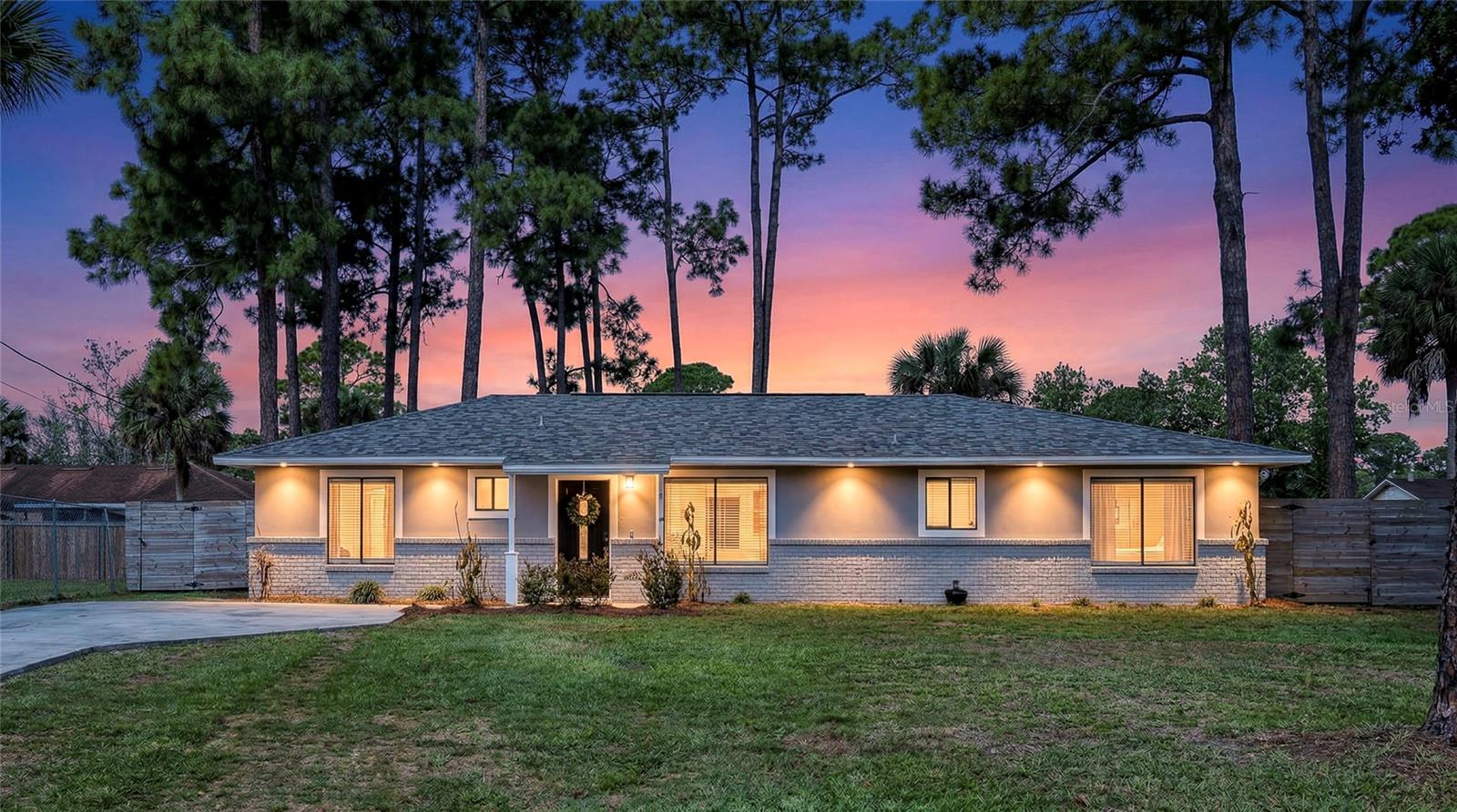 Welcome home to this beautifully updated Port St. John property on Florida’s Space Coast! 
Offering modern style and effortless living. Featuring tile flooring throughout, this home delivers both durability and a clean, cohesive look from room to room. The open-concept layout creates a bright and inviting space, perfect for everyday living and entertaining. The fully updated kitchen is the heart of the home, showcasing quartz countertops, wood cabinetry, a sleek stainless steel hood vent, and a convenient pot filler - blending function with elevated design. Step outside to enjoy a fully fenced backyard, ideal for pets, play, or relaxing evenings. The enclosed lanai with tile flooring extends your living space, creating the perfect spot for morning coffee or hosting guests year-round. The primary suite offers a private retreat with a step-in shower, while the guest bathroom features a tub/shower combo for added flexibility. A charming touch awaits in the third bedroom, highlighted by a stylish shiplap accent wall- perfect as a guest room, office, or creative space. The roof was replaced in 2021, HVAC system 2018, and a tankless water heater, providing energy efficiency and endless hot water for modern convenience, giving you peace of mind for years to come. Close to schools, shopping, major employers, and the beaches, river, and attractions of the Space Coast. Don’t miss this move-in-ready gem with thoughtful updates throughout. Schedule your private showing today and make 5614 Jamaica Road your new address! The information contained in this listing was acquired from public records and seller and is deemed to be accurate. However, neither Ivania Bosch nor Berkshire Hathaway HS Florida Realty make any guarantees as to the accuracy of the information. Buyer and Buyer's agent to verify information.