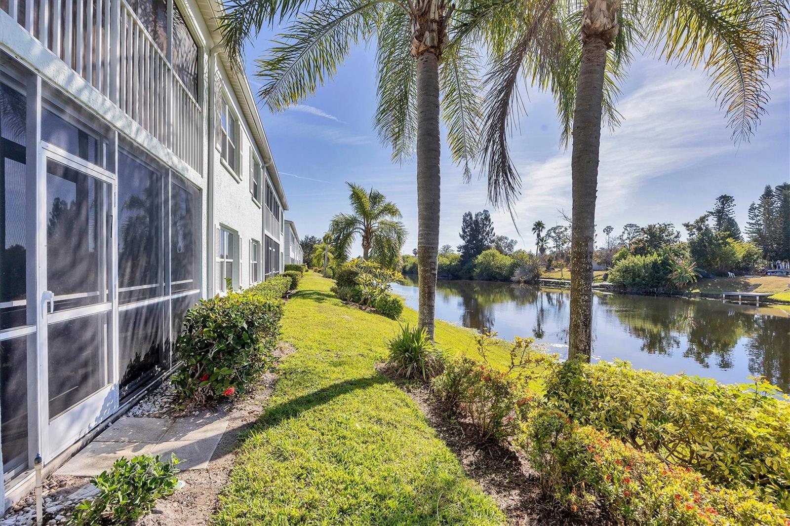 SELLER IS MOTIVATED-MAKE AN OFFER! Whether you’re searching for the perfect Florida getaway or a place to call home year-round, this two bedroom and two full bathroom condominium is tastefully decorated and offered TURNKEY FURNISHED. Located on the FIRST-FLOOR this warm and inviting condominium offers effortless Florida living at its finest and the convenience of no stairs. The bright open kitchen is a chef’s delight, featuring BRAND NEW STAINLESS STEEL APPLIANCES, a large closet pantry, and a breakfast bar that flows seamlessly into the open living and dining areas, ideal for entertaining or relaxed everyday living. A charming breakfast nook provides the ideal spot to enjoy your morning coffee. Relax and unwind on the screened patio and enjoy the tranquil WATER VIEW of the CoCoPlum Waterway. Sliding vinyl panels transform this space into an all-weather Florida room, allowing you to enjoy it comfortably year-round. The desirable split bedroom floor plan ensures privacy for both owners and guests. The generous primary suite easily accommodates a king-size bed and features two spacious closets, an ensuite bathroom with a large step-in shower, and sliding glass doors leading directly to the screened lanai with stunning water views. The guest area offers a comfortable second bedroom, a full bath with a tub/shower combination, and a conveniently located laundry closet. A pocket door creates a private guest suite for added privacy and convenience. CocoPlum Condominiums is a small, well-maintained, 55 and older maintenance-free community with low HOA fees of just $277 per month, which include grounds care, pest control, water and sewer, exterior maintenance and more. Take advantage of the heated community pool and outdoor barbeque grill, just a few steps away, perfect for gathering with friends and neighbors. Ideally located in North Port, this home is just minutes from US-41 and an abundance of dining, shopping, and recreation. Enjoy nearby Downtown Wellen Park, featuring waterfront dining, live concerts, a weekly farmers market, and the Atlanta Braves Spring Training Stadium. Also in close proximity are the CocoPlum Village Shoppes featuring Publix Supermarket, a variety of restaurants and retail shops and the beautiful Venice beaches are just a short drive away. This is your opportunity to enjoy Florida living at its best, surrounded by friendly neighbors, peaceful water views, and endless lifestyle amenities. With no rentals allowed in the community, you can rest assured that your new home will remain peaceful and private. Schedule a showing today to start living the Florida lifestyle you’ve always dreamed of.