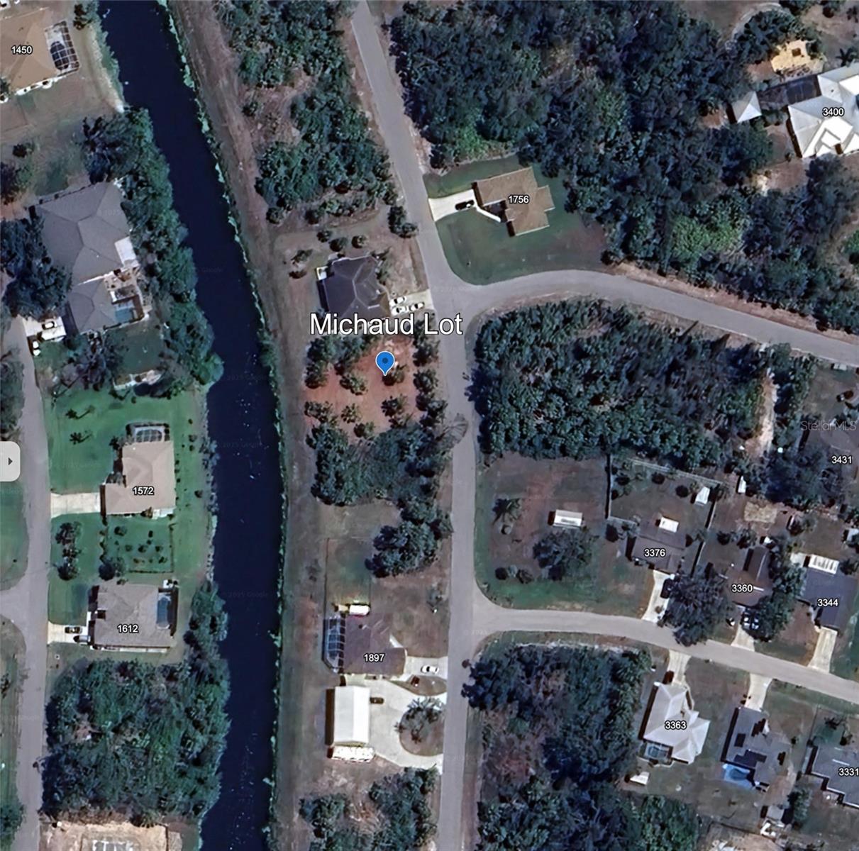 Cleared and filled lot on a freshwater canal and is not in a flood zone or HOA.    Makes a great building site!  In an up-and-coming neighborhood. Close to shopping, golf, restaurants and parks. Come and check this one out!