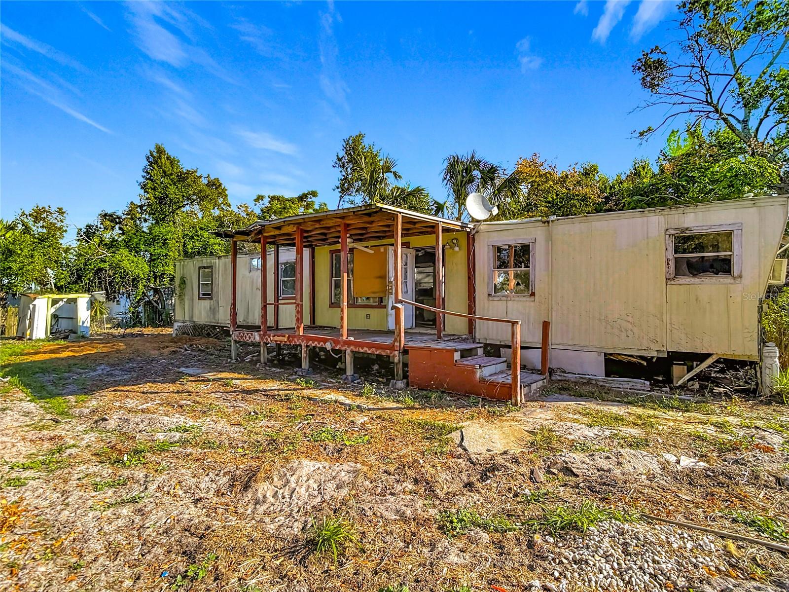 Virtually Staged. Mobil Home Locate at Subdiv: BAYONET POINT ANNEX. Great Opportunity for Investors or Build you own new Home. Lot Size: 7,000 SqFt . The property needs total Rehab. The property has Septic System tank and well. Large Fenced Chain Link around the Property. NO HOA. The seller clean the land and Cut Trees with professional Company. Storage Shed. Great central location/ North of State 52 and US19, The property is close to Beach, Restaurants, Supermarkets, Banks, Shopping Centers, Medical Facilities, main streets ETC. Don't miss out on this great opportunity!