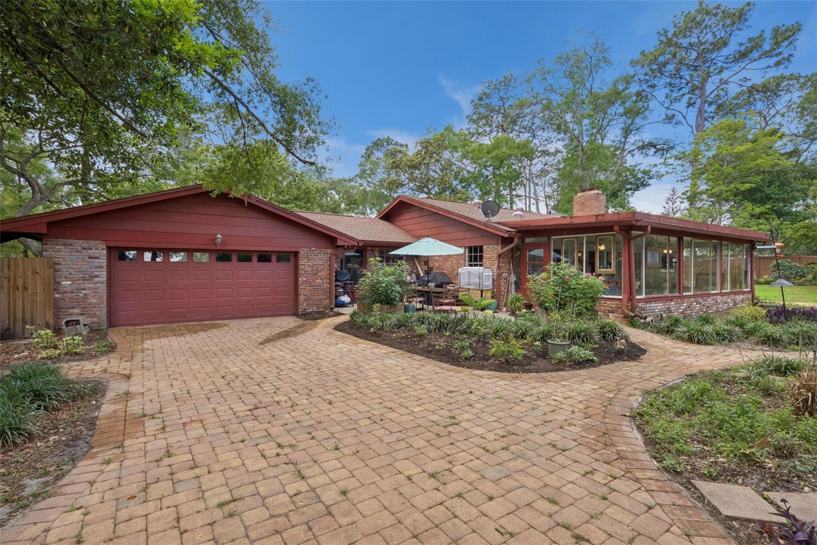 Back on market at no fault of the seller or property!

One-of-a-kind mid-century ranch on over half an acre with extensive system upgrades, a stunning wood-burning brick fireplace, and a private backyard oasis designed for true indoor-outdoor living.

Welcome to a rare mid-century ranch retreat situated on an expansive corner lot spanning more than half an acre. Combining timeless character with substantial infrastructure improvements, this property offers a unique opportunity to enjoy the charm of an established home without many of the major expenses buyers often anticipate.

One of the home's most compelling features is the significant investment already made in its major systems and components. Recent improvements include electrical upgrades with a new service line and panel, plumbing updates (2019), well and irrigation improvements, roof cleaning with warranty, generator with dedicated panel, newer A/C components under warranty, water heater, and reverse osmosis system. These upgrades provide added peace of mind and help reduce future maintenance concerns, especially as Florida's hurricane season approaches.

At the heart of the home, the expansive great room showcases a dramatic wall-to-wall brick wood-burning fireplace, creating a warm and inviting focal point for gathering and everyday living. Natural light fills the home through Solatube skylights and sliding glass doors that seamlessly connect interior spaces to the outdoors.

The spacious Florida Room, lined with windows overlooking the backyard, offers incredible flexibility as a game room, lounge, home office, fitness space, or creative retreat.

The kitchen blends character and functionality with a copper farmhouse sink, induction cooktop, double ovens, wine refrigerator, and a dedicated coffee and wine bar. Adjacent to the kitchen, a versatile utility and mudroom with additional pantry storage provides access to a private courtyard.

Step outside into your own private garden oasis. The fully fenced triple-lot backyard is designed for both entertaining and relaxation, featuring newly installed pavers, multiple seating areas, a fire pit, brick outdoor grill, dedicated gardening space, and mature landscaping that enhances privacy throughout the property.

Originally designed as a four-bedroom home, one bedroom has been converted into an oversized utility space and can be reverted if desired.

Additional features include private well water, generator capability, no HOA, and a rare amount of usable outdoor space that is increasingly difficult to find in Altamonte Springs.

Ideally located minutes from Orlando Health, AdventHealth Altamonte Springs, HCA Florida Lake Monroe Hospital, Cranes Roost Park, Altamonte Mall, dining, shopping, and major roadways, this home offers the perfect balance of privacy, convenience, and character.

A truly distinctive Central Florida property where the major work has already been done—allowing the next owner to simply move in and enjoy.