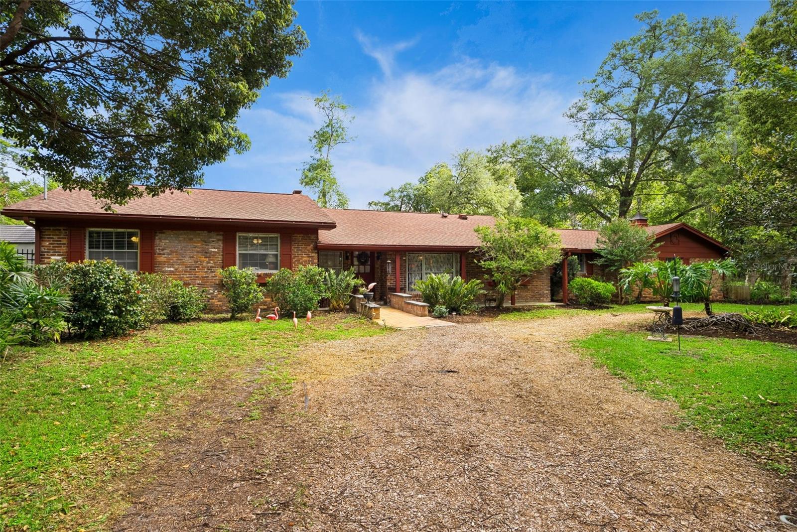 Back on market at no fault of the seller or property!

One-of-a-kind mid-century ranch on over half an acre with extensive system upgrades, a stunning wood-burning brick fireplace, and a private backyard oasis designed for true indoor-outdoor living.

Welcome to a rare mid-century ranch retreat situated on an expansive corner lot spanning more than half an acre. Combining timeless character with substantial infrastructure improvements, this property offers a unique opportunity to enjoy the charm of an established home without many of the major expenses buyers often anticipate.

One of the home's most compelling features is the significant investment already made in its major systems and components. Recent improvements include electrical upgrades with a new service line and panel, plumbing updates (2019), well and irrigation improvements, roof cleaning with warranty, generator with dedicated panel, newer A/C components under warranty, water heater, and reverse osmosis system. These upgrades provide added peace of mind and help reduce future maintenance concerns, especially as Florida's hurricane season approaches.

At the heart of the home, the expansive great room showcases a dramatic wall-to-wall brick wood-burning fireplace, creating a warm and inviting focal point for gathering and everyday living. Natural light fills the home through Solatube skylights and sliding glass doors that seamlessly connect interior spaces to the outdoors.

The spacious Florida Room, lined with windows overlooking the backyard, offers incredible flexibility as a game room, lounge, home office, fitness space, or creative retreat.

The kitchen blends character and functionality with a copper farmhouse sink, induction cooktop, double ovens, wine refrigerator, and a dedicated coffee and wine bar. Adjacent to the kitchen, a versatile utility and mudroom with additional pantry storage provides access to a private courtyard.

Step outside into your own private garden oasis. The fully fenced triple-lot backyard is designed for both entertaining and relaxation, featuring newly installed pavers, multiple seating areas, a fire pit, brick outdoor grill, dedicated gardening space, and mature landscaping that enhances privacy throughout the property.

Originally designed as a four-bedroom home, one bedroom has been converted into an oversized utility space and can be reverted if desired.

Additional features include private well water, generator capability, no HOA, and a rare amount of usable outdoor space that is increasingly difficult to find in Altamonte Springs.

Ideally located minutes from Orlando Health, AdventHealth Altamonte Springs, HCA Florida Lake Monroe Hospital, Cranes Roost Park, Altamonte Mall, dining, shopping, and major roadways, this home offers the perfect balance of privacy, convenience, and character.

A truly distinctive Central Florida property where the major work has already been done—allowing the next owner to simply move in and enjoy.
