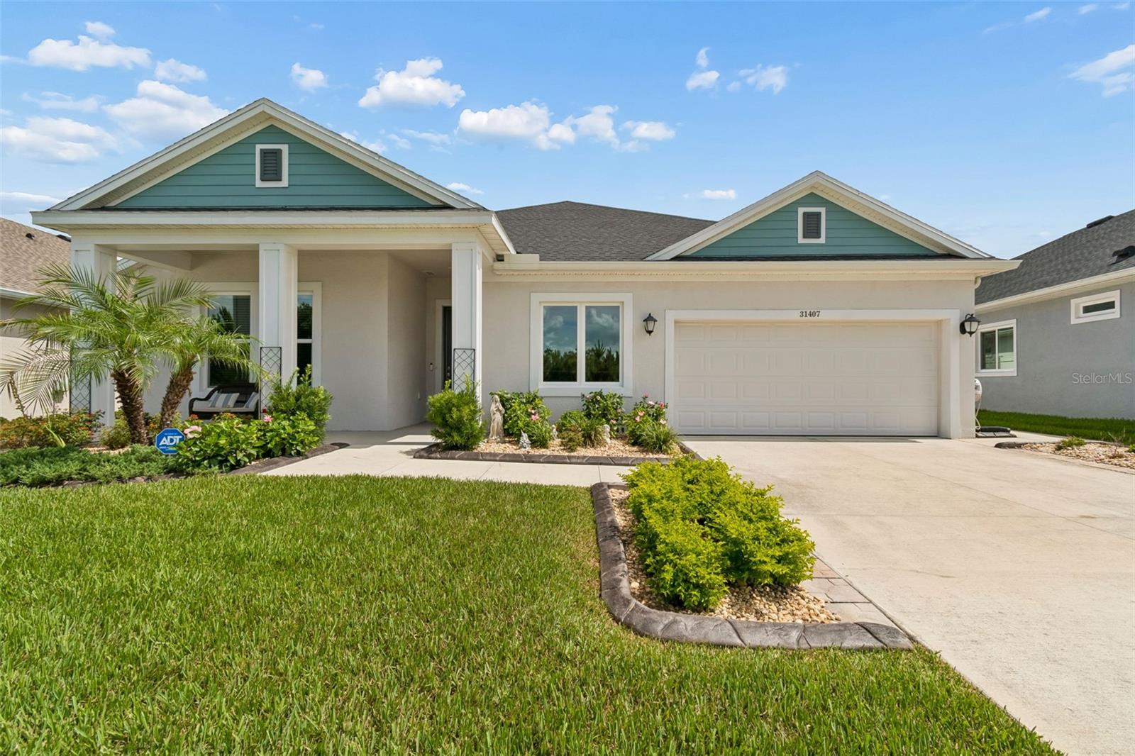 Welcome to this beautifully maintained high-end DAVID WEEKLEY home located in the highly desirable
community of CHAPEL CROSSINGS in Wesley Chapel. The HIGHLANDALE layout offers 4
BEDROOMS, 3 FULL BATHROOMS, A FLEX/DEN, AND A 3-CAR GARAGE (interior), this home sits
on a PREMIUM POND AND CONSERVATION HOMESITE with NO REAR NEIGHBORS and NO
HOMES DIRECTLY ACROSS THE STREET. Built in 2023 and enhanced with OVER $40,000 IN
UPGRADES, this home offers the feel of new construction without the wait. This stunning community has a LOW HOA FEE and INCLUDES CABLE AND INTERNET. 

From the welcoming FRONT PORCH to the extended outdoor living space, this home has been thoughtfully
improved and meticulously maintained. The open-concept floor plan features LUXURY VINYL PLANK
FLOORING, 8-FOOT DOORS, abundant natural light, and a layout that offers both functionality and
flexibility. The FLEX/DEN provides additional space for a home office, playroom, or hobby room.
The kitchen features QUARTZ COUNTERTOPS, a BUILT-IN APPLIANCES, HOOD VENT, cooktop, a
large center island, abundant cabinetry, and an open connection to both the dining area and spacious great room.
Large windows across the rear of the home showcase the peaceful pond and conservation views from the main
living areas.
The PRIMARY SUITE overlooks the pond and conservation area and features a SPACIOUS WALK-IN
CLOSET and ensuite bathroom. The split-bedroom layout provides privacy for family members and guests.
One of the standout features of this floor plan is the front secondary bedroom with its own PRIVATE EN-
SUITE BATHROOM, making it an excellent option for guests, extended family, or multigenerational living.
This home has been enhanced with OVER $40,000 IN IMPROVEMENTS, including a FULLY FENCED
BACKYARD ($7,000), EXTENDED SCREENED LANAI ($20,000), EPOXY GARAGE FLOOR,
UPGRADED LANDSCAPING WITH DECORATIVE CURBING AND ROCK BEDS ($4,000), GUTTERS,
ADDITIONAL SIDEWALK ACCESS AROUND THE HOME for backyard entertaining, ceiling fans, and
a custom walk-in shower in the secondary bathroom.
The EXTENDED SCREENED LANAI overlooks tranquil pond and conservation views and is complemented
by the FULLY FENCED BACKYARD, creating a private outdoor space to enjoy year-round. The additional
sidewalk access and completed fencing add both functionality and value, while the upgraded landscaping
enhances the home's curb appeal.
Residents of CHAPEL CROSSINGS enjoy exceptional RESORT-STYLE AMENITIES including a LAZY
RIVER, resort-style pool, clubhouse, FITNESS CENTER, dog parks, playgrounds, tennis courts, pickleball
courts, walking trails, and community events throughout the year. Conveniently located near shopping, dining,
medical facilities, top-rated schools, and major highways, this location continues to be one of Wesley Chapel's
most desirable master-planned communities.
With expensive UPGRADES, a PREMIUM POND AND CONSERVATION VIEW, 3-CAR GARAGE (2
car garage door with a third bay inside in width, not tandem), PRIVATE EN-SUITE GUEST ROOM, and
outstanding community amenities, this home stands out from both resale and new construction options in the
area.