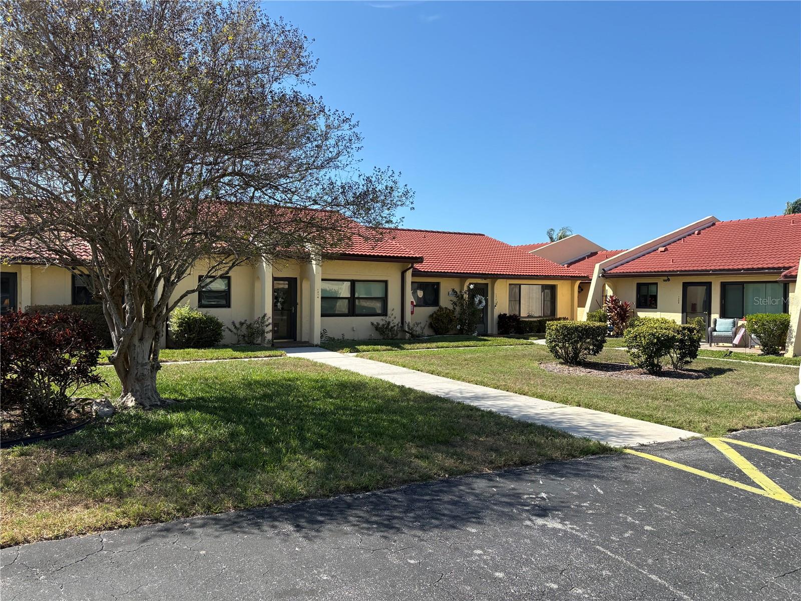 Have you heard about Meadowcroft Villas? This vibrant 55+ community offers a fantastic range of amenities, including a heated pool, tennis courts, a clubhouse, shuffleboard and even fishing. Meadowcroft's ideal location which is peaceful and quiet provides easy access to shopping, medical facilities, a hospital, restaurants, golf courses, entertainment options, and the beautiful beaches of Anna Maria Island. As a pet-friendly community, Meadowcroft offers maintenance-free living and a variety of activities throughout the year all in a peaceful and quiet neighborhood.

This attractive, well-cared-for and recently refreshed 2BR/2BA Villa boasts abundant natural light and features an updated fully equipped kitchen including a dishwasher and microwave, volume ceilings in the main living area, primary bedroom with an updated en-suite bathroom, newer AC (2020) and hot water heater (2020), a new roof (2021), and a brand-new stack washer/dryer (2025). A covered carport is conveniently located just steps from your front door, and the 8' x 25' Florida room full of natural light provides a versatile additional space.  The unit also has a storage room for all of your extras.  Recent updates include fresh interior paint, new vanity and recessed lighting in the guest bathroom, recessed lighting in the kitchen, new blinds in bedrooms and bathrooms, many new light fixtures.

The monthly HOA fee covers water, sewer, trash, recycling, cable, internet, termite protection and amenities. Residents are actively involved in organized events such as dances, poker nights, game nights, and more. The clubhouse features a kitchen, dance floor, TV, piano, library, and billiards room.

Whether you enjoy fishing in the lake, playing tennis, or swimming in the heated pool, Meadowcroft provides the perfect opportunity to embrace the Florida lifestyle and a welcoming community.  Enjoy this unit as a second home but if you are not ready to call Florida home you can take advantage of renting it out as a seasonal or long-term rental.