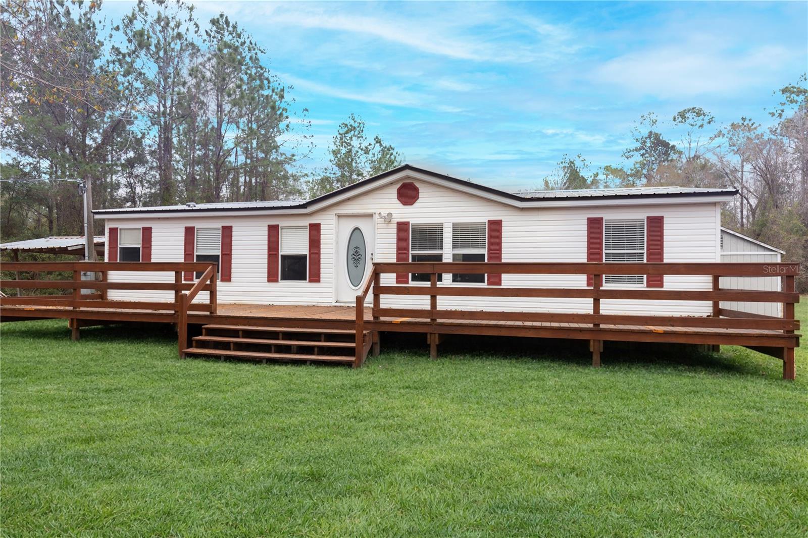 Welcome to your private country retreat! This charming 3-bedroom, 2-bath home is perfectly situated on 22.5 beautiful acres, offering peace, privacy, and endless possibilities. Enjoy your morning coffee or evening sunsets from the huge front porch overlooking the scenic countryside—perfect for relaxing and taking in the tranquil setting. Inside, the home features a comfortable and functional layout with plenty of natural light, ideal for both everyday living and entertaining. The expansive acreage provides ample room for livestock, gardening, recreation, or simply enjoying wide-open spaces. The property also includes a convenient carport and a shed, offering excellent storage for equipment, tools, or outdoor toys. Whether you're looking for a quiet homestead, mini-farm, or weekend escape, this property delivers the best of country living while still being within reach of town. Don’t miss this rare opportunity to own your own slice of paradise!