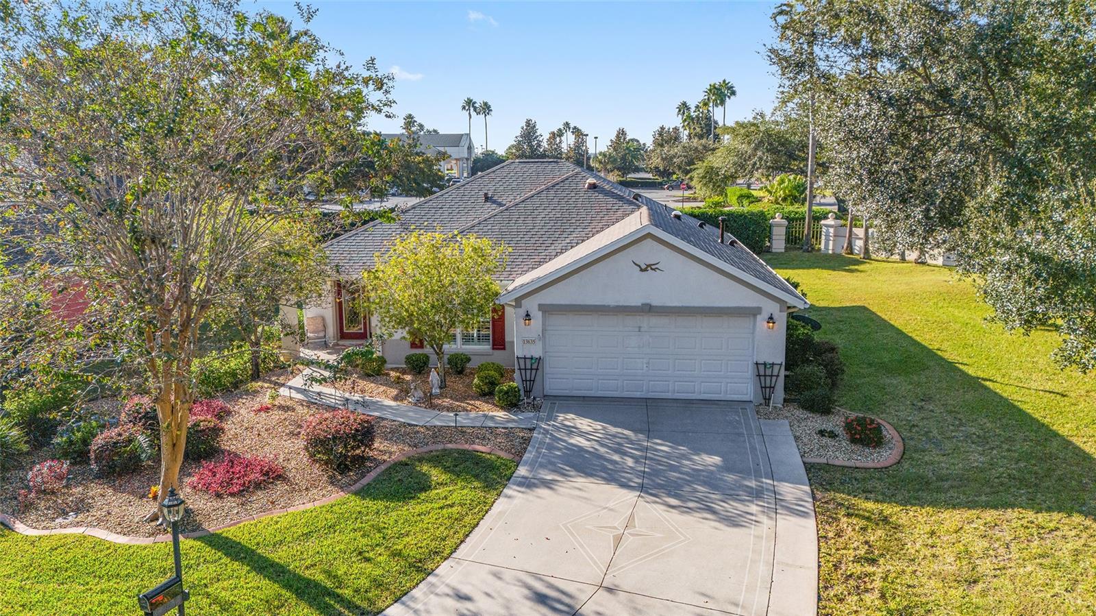 Welcome to your dream home in Del Webb Spruce Creek Golf and Country Club! This charming, well maintained ALYDAR block and stucco model boasts 2 bedrooms, 2 baths, and a 2-car garage, situated on a peaceful CUL-DE-SAC.  Painted and EXPANDED driveway and mature landscaping surround the home! -- ROOF: 2022!!  -- This 1,346 sq ft home features an additional 120 sq ft enclosed LANAI UNDER HEAT AND AIR (from main unit), perfect for year-round relaxation, along with a 24 Ft x 12 Ft concrete painted rear patio where you can soak in the Florida sunshine. Plus, there are NO HOMES BEHIND and a privacy hedge, offering you added SECLUSION. -- The location couldn't be better; you're just a stone's throw away from the Horizon Community Center, Restaurant and Golf Pro Shop!!! -- Inside the home, you'll find Engineered Hardwood Floors throughout the main living area, PLANTATION SHUTTERS throughout and 3 SOLAR TUBES that flood the space with natural light.  -- The beautifully appointed kitchen has GRANITE COUNTERTOPS and oak cabinets equipped with convenient PULL-OUT DRAWERS and a closet pantry.  -- INSIDE LAUNDRY ROOM!  --  Don't miss this opportunity to own a piece of Florida paradise in a community with so many great amenities and activities. Schedule a showing today and make this fantastic property your new HOME SWEET HOME!!