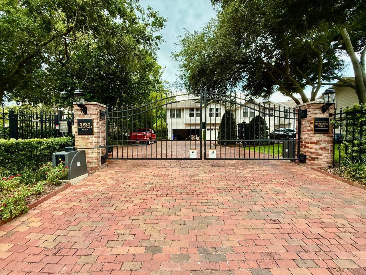 Welcome to this beautifully maintained 3-bedroom, 2.5-bath townhome in Bayshore Walk Condominium, a gated and meticulously maintained community known for its peaceful atmosphere, attractive landscaping, and pride of ownership. This spacious home offers a bright, functional floor plan with generous living and dining areas and a well-appointed kitchen featuring elegant quartz countertops, ample cabinet space, and plenty of counter space for meal preparation and entertaining. The home also includes a one-car garage and assigned parking for added convenience. Step outside to the private decked back porch, an ideal place to enjoy your morning coffee, relax with a book, or unwind after a long day. The outdoor space is enhanced by beautiful orchids that bloom each year, creating a colorful and tranquil setting. Water, sewer, trash service, lawn care, pool maintenance, and community pool access are included in the monthly rent. Bayshore Walk offers beautifully maintained grounds, quiet surroundings, and convenient access to shopping, dining, entertainment, and major roadways. In addition to the advertised base rent, all residents are enrolled in the Resident Benefits Package for $50 per month, which includes HVAC air-filter delivery, credit-building benefits, utility concierge service, and more. Additional details are available upon application. Pets may be accepted at the owner's discretion. A maximum of two pets is permitted, with a maximum weight of 60 pounds each. No aggressive breeds. Vacant and available now!