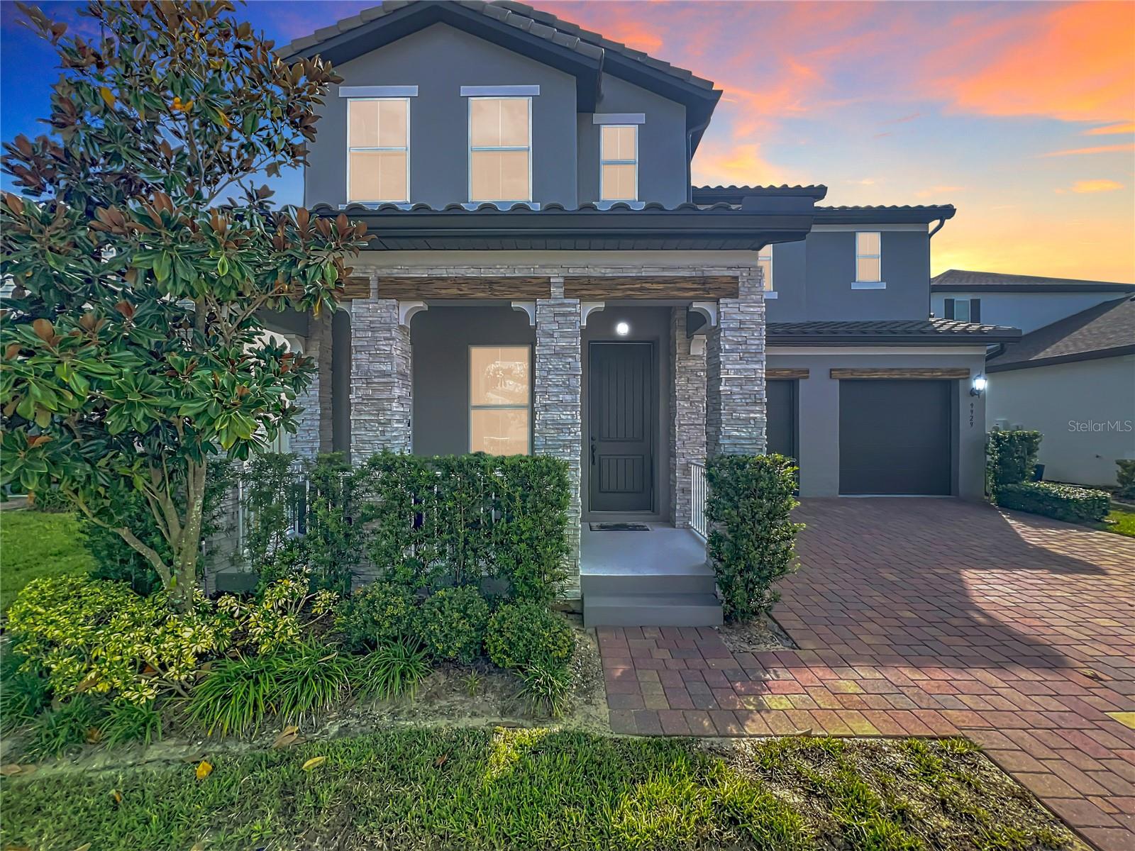 From the moment you step through the front door of this thoughtfully designed 5-bedroom, 5-bath home in Winter Garden’s sought-after
Watermark community, it feels like home. Natural light pours into the open-concept living space, where everyday moments unfold with ease.
Cook family meals in the stunning kitchen featuring quartz countertops, a custom backsplash, stainless steel appliances, an oversized island, and a walk-in pantry with built-in shelving. Gather around the island for morning coffee or late-night laughs, while Sonos in-ceiling surround sound sets the tone throughout the main living areas. Downstairs, the private guest suite is perfect for visitors or multigenerational living, while the dedicated office offers a quiet space to focus or create. Upstairs, the loft becomes the hub for game nights or movie marathons, with three additional bedrooms and a luxurious primary suite just down the hall. Every detail has been carefully chosen, from designer lighting and ceiling fans in all rooms and common areas to wood-look tile and plush carpeting underfoot. Function meets style in the laundry room, complete with cabinetry, a tile backsplash, and a deep utility sink. Additional enhancements include a water softener system, epoxy flooring in the oversized 2-car garage, and 7-inch seamless gutters that add both form and function to the exterior. Outside, enjoy the covered lanai and fully fenced backyard, perfect for future pool plans or peaceful evenings. With ample storage and access to top-rated schools, shopping, dining, and resort style amenities, this home offers more than just space. It offers a lifestyle. Come see how it feels to come home.