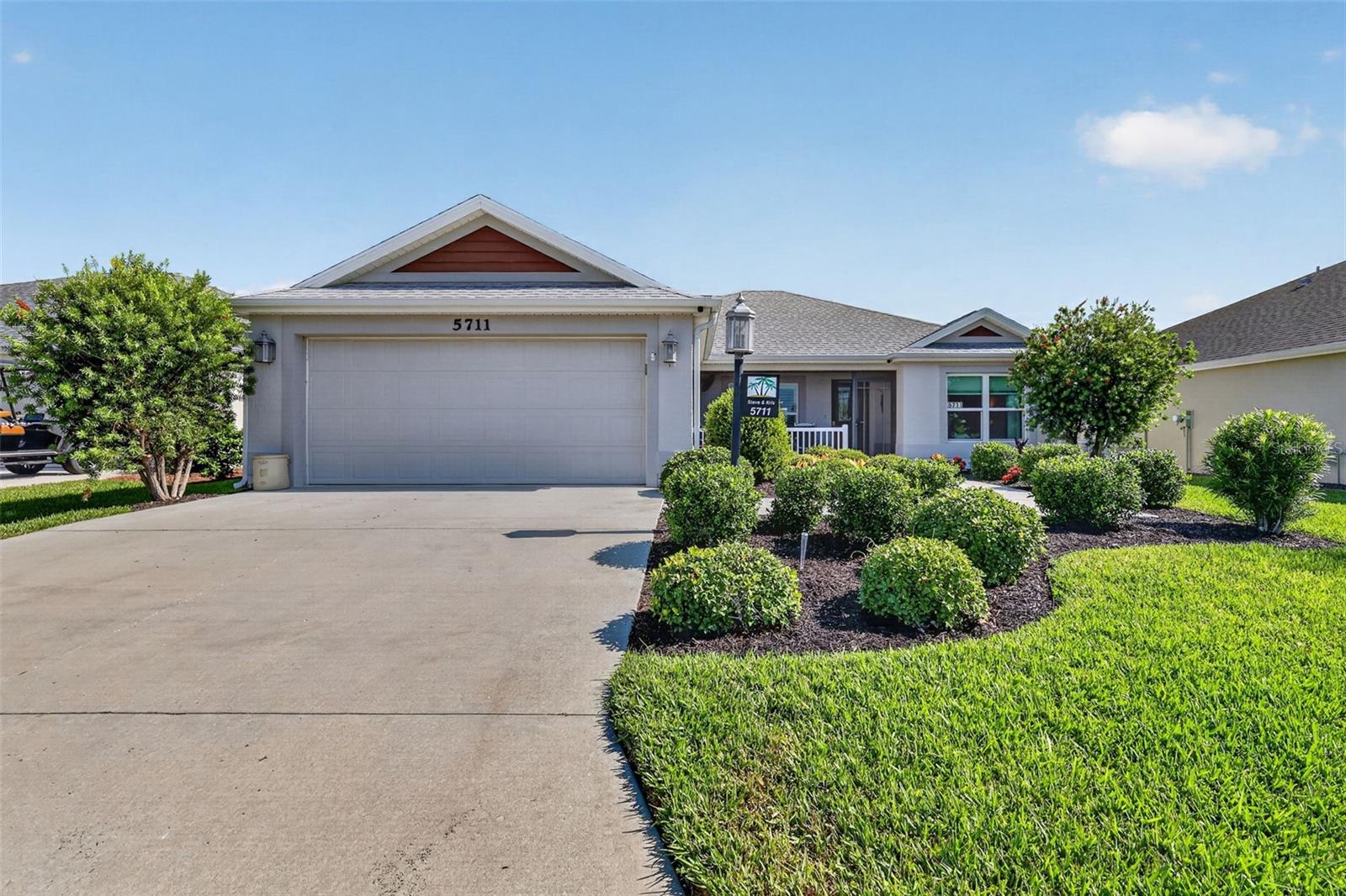3 bedroom/2 bathroom ALDER model in the Village of Linden Isle with WATER VIEW in front and PRIVACY WALL in back, FURNITURE & GOLF CART INCLUDED! You will notice fresh landscaping in the front when you walk up to the block/stucco home with a screened front porch, perfect spot to relax and watch the wildlife from across the street. As you step in, you will notice an open split floor plan with HIGH ceilings, tile throughout main living areas and PLANTATION SHUTTERS. The kitchen boasts a LARGE ISLAND, tile backsplash, stainless steel appliances with GAS range, lower pull out cabinet drawers, and pantry closet. INSIDE LAUNDRY off of the kitchen with utility sink. Primary bedroom features en suite bathroom with TWO WALK-IN closets, DOUBLE SINK vanity, STEP-IN shower, and toilet closet. On the other side of home, pocket door leads into guest quarters with hallway linen closet. both guest bedrooms have built-in closets and guest bathroom features tub/shower combo. The den off of the dining room creates another great seating area that leads out to the ENCLOSED lanai with MINI AC SPLIT, SLIDING windows and pull down shades. Back side patio set up with grill and backyard features PRIVACY WALL. The garage with epoxy flooring is equipped with an EV Tesla charger, WHOLE HOUSE WATER FILTRATION system, and pull down attic stairs. The home also has a backup GENERAC generator. Enjoy being close distance to Riverbend Rec Center with family pool, Everglades Rec Center with sport pool, nearby Rupert dog park, Magnolia Shopping Plaza across the street. Only 3 miles from the new Eastport, 3.5 miles from Market at Sawgrass Grove and 5 miles from Brownwood Paddock Square! Schedule your private showing to see this great FURNISHED home in The Villages, FL today!