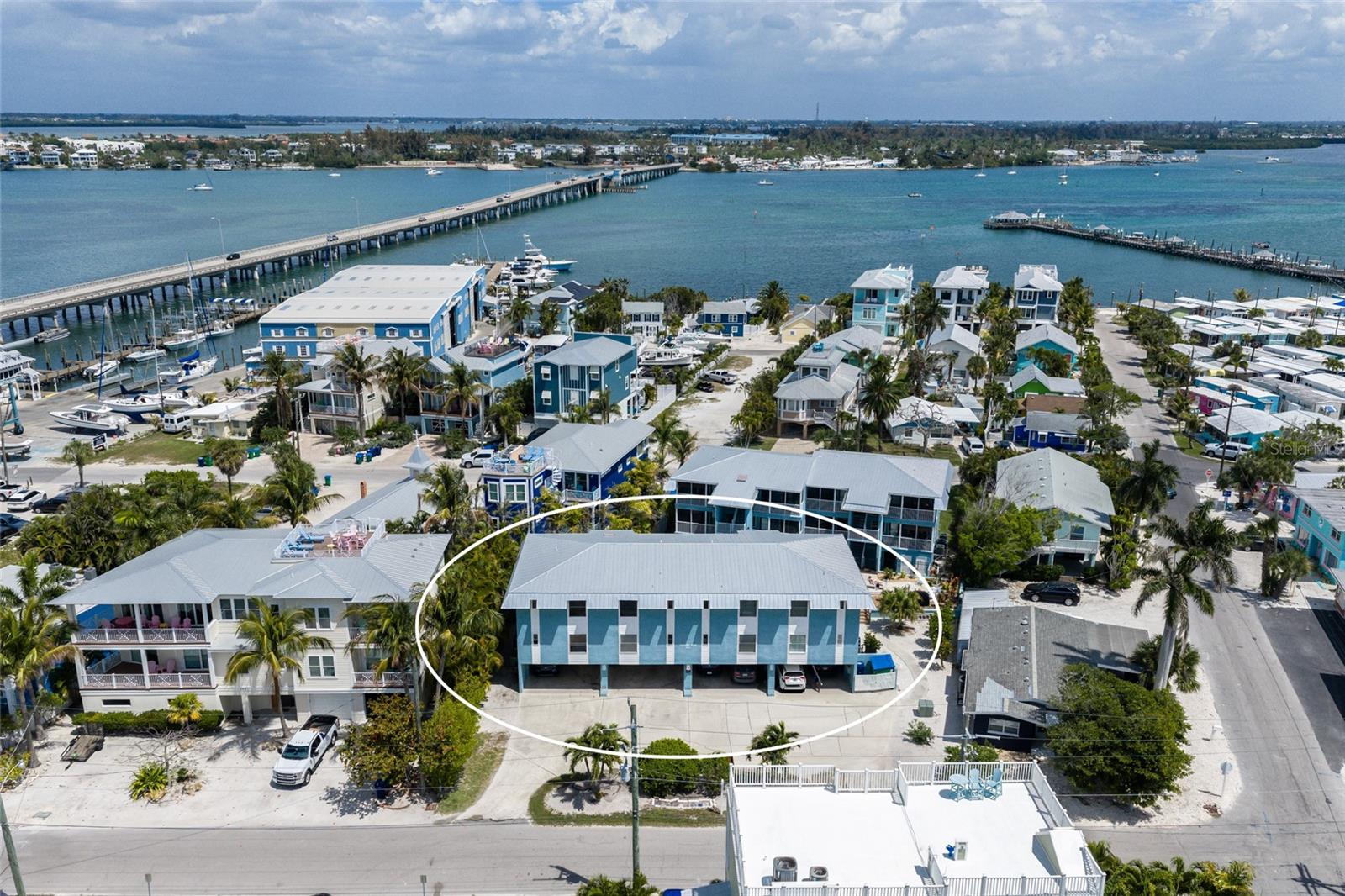 Kick off your flip-flops and settle in—this turnkey furnished 1BD/1BA condo is your ticket to the easy, sandy-toes lifestyle that makes Anna Maria Island so irresistible. Just steps from the beach in the heart of Bradenton Beach, it's packed with island charm and ready for sunny days, salty hair, and lazy afternoons by the pool.
The layout lives bigger than you'd expect, with a screened lanai overlooking the pool—the perfect perch for morning coffee, Gulf breezes, and post-beach happy hours. A carport and dedicated storage keep beach gear, bikes, and paddleboards tucked away and ready for the next adventure.
Step outside and you're moments from the sand, plus an easy stroll to the shops, dining, and entertainment of historic Bridge Street. Hop the trolley, grab a bite, catch live music, or just wander—everything you need for that classic island day is right at your doorstep. And when it's time to come and go, easy on-and-off-island access keeps the mainland close.
Short-term rentals are permitted, so whether you're dreaming of a personal beach hideaway, a smart income property, or the best of both, this one checks every box. New Roof, AC and hot water heater in 2025. Welcome to island time.