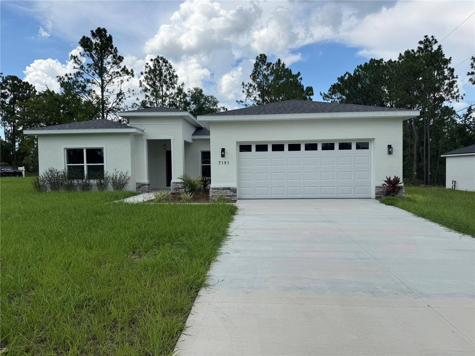 Welcome to this stunning, newly built 2026 home located at 7191 SW 133rd Lane in Ocala! This beautiful property offers 4 spacious bedrooms, 3 full bathrooms, approximately 1,865 square feet of living space, and a two-car garage. The bright, open-concept floor plan is perfect for comfortable living and entertaining. The modern kitchen features quartz countertops, stainless steel appliances, ample cabinetry, and a large center island overlooking the living and dining areas. Enjoy stylish finishes throughout, generously sized bedrooms, and a covered lanai ideal for relaxing outdoors. Situated on an oversized corner lot with no HOA, this attractive home offers privacy, convenience, and plenty of space. Conveniently located near shopping, dining, schools, and major roadways. Schedule your private showing today—this beautiful rental will not last!