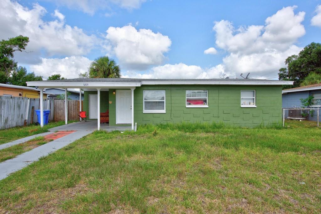 Comfort, convenience, and opportunity come together in this charming 3-bedroom, 1-bath home located in the established Progress Village area of Tampa. Thoughtfully designed for everyday living, the interior features durable flooring throughout, an inviting eat-in kitchen perfect for casual meals and gatherings, central heating and air conditioning, and ceiling fans that enhance year-round comfort. Set on a spacious 6,540-square-foot lot, the property offers plenty of room to enjoy the Florida lifestyle. Whether you're envisioning weekend barbecues, a play area, a garden, or simply a private outdoor retreat, the large backyard provides endless possibilities. Covered parking and additional storage space add convenience and functionality to the home's appeal. The location is equally impressive, placing you just minutes from major highways, shopping, dining, schools, and downtown Tampa. With no HOA restrictions, you'll enjoy the freedom to make the property your own while benefiting from the growth and development happening throughout the surrounding area. Ideal for first-time homebuyers, downsizers, or a smart addition to your investment portfolio, this well-positioned property offers affordability, flexibility, and the chance to enjoy everything Tampa has to offer. ***FREE 1/0 Rate Buydown when using the seller's preferred lender!***