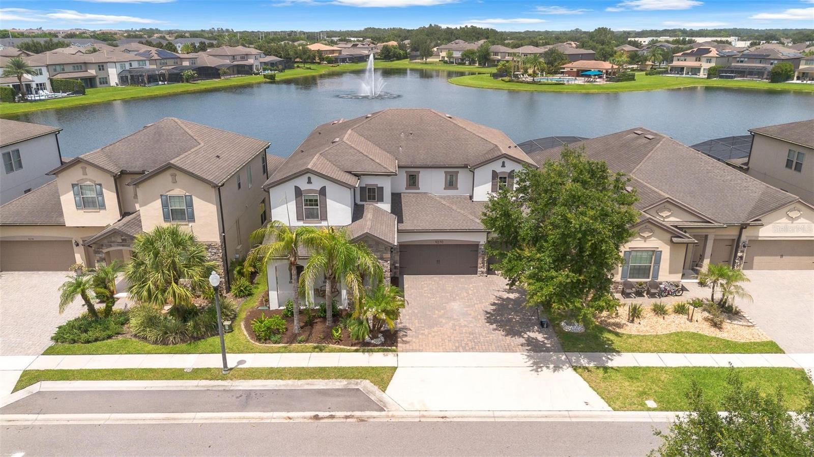 Nestled within the highly sought-after Royal Estates community by Pulte Homes, this exceptional five-bedroom, five-bathroom residence offers an elegant blend of luxury, comfort, and location. Perfectly positioned on a premium waterfront homesite, the home showcases tranquil water views that create a stunning backdrop for everyday living.
Designed with both comfort and entertaining in mind, the home features a private office, a desirable possible in-law suite, an extended covered lanai, gourmet chef’s kitchen, and French doors that seamlessly connect the interior living spaces to the outdoors. At the heart of the home is the impressive family room, where soaring double-height ceilings frame picturesque views across the pool and water beyond, filling the space with natural light and creating a true sense of openness.
The outdoor living experience is equally impressive, with a sparkling pool overlooking the water, providing the perfect setting to relax, unwind, or entertain guests while enjoying the peaceful surroundings. The three-car garage offers ample storage, including ceiling-mounted storage racks and a Tesla Wall Connector already installed. The home is also fully equipped with smart home technology, allowing app-based control of the garage doors, HVAC systems, pool equipment, lighting, cameras, and security system, while Cat6 wiring throughout ensures it is ready for the next generation of high-speed connectivity.
Residents of Royal Estates enjoy access to outstanding community amenities, including a resort-style pool, covered seating and gathering areas, and a playground. Ideally located just minutes from downtown Windermere and Disney’s Magic Kingdom, the home offers convenient access to upscale shopping, dining, major roadways, and Central Florida’s world-renowned attractions. Families will appreciate the proximity to some of the area’s top-rated A-rated public schools, as well as highly regarded private schools including Windermere Preparatory School and Foundation Academy.
Combining beautiful water views, exceptional living spaces, outstanding schools, and a premier location, this home offers an outstanding opportunity to enjoy the very best of the Windermere lifestyle.
