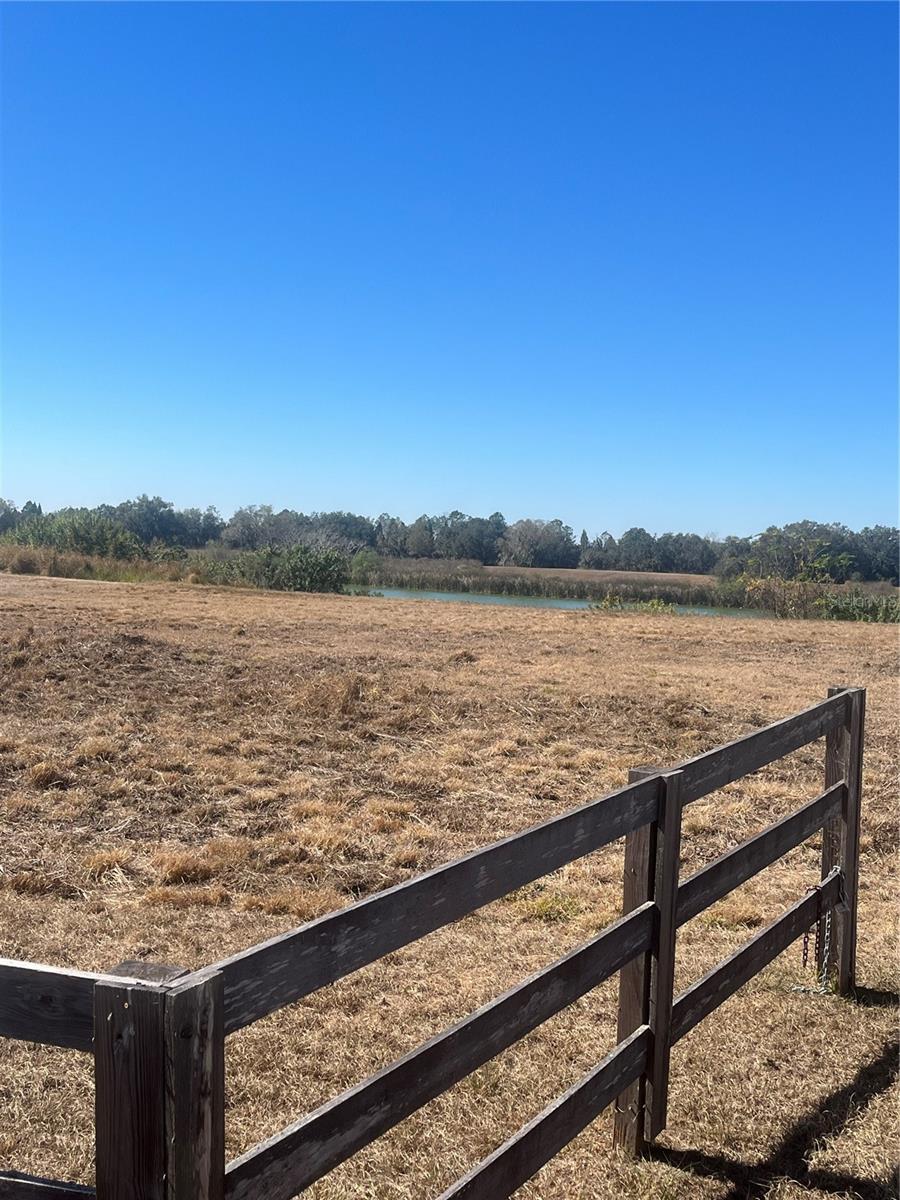 Rare opportunity to own 5 acres in The Ranches at Ranger Lake.  This property has a private lake stocked with bass and rumor has it that bass fishing competitions were done here.   This is beautiful private setting for your custom home.  In addition to your beautiful custom home you may build a second residence up to 1,500 SF.  Maybe perfect for that "parent's cottage".   Residents enjoy exclusive access to a private boat ramp.   No time restrictions on when you must build.  And did I mention that you can have a horse?  Most farm animals are allowed.