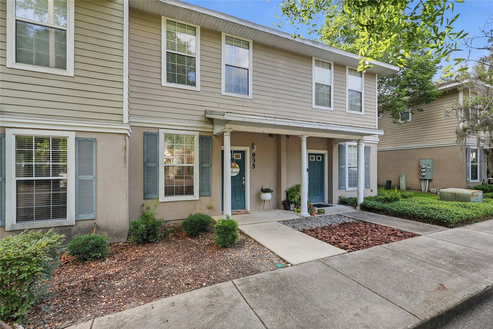 Updated, inviting, and ideally located just minutes from the University of Florida this 2-bedroom, 2.5-bath condo in Garland Condominiums offers comfort, convenience, and thoughtful upgrades throughout! Upon entering the home you’ll be greeted by warm Luxury Vinyl Plank flooring flowing through the main living areas and an open downstairs layout that feels bright, welcoming, and easy to live in. The spacious living and dining area offers plenty of room to relax or entertain, with sliding glass doors leading to a covered patio and exterior storage closet—perfect for morning coffee, evening unwinding, or keeping everyday extras tucked away. The upgraded kitchen features granite countertops, a tile backsplash, pantry, pass-through breakfast bar, updated lighting fixtures, and a window that fills the space with natural light. A convenient downstairs half bath, under-stair storage, and inside laundry closet with Kenmore Elite washer and dryer included add everyday practicality. Upstairs, both bedrooms offer the privacy of ensuite bathrooms. The large primary suite features two spacious walk-in closets, sliding glass doors to a private balcony, and an upgraded bathroom featuring granite countertops, tile flooring, a tiled shower with decorative accent inlay & shower niche, and a linen closet. The second bedroom also includes a generous walk-in closet and a bathroom with granite countertops that can be accessed from either the bedroom or hallway. Garland Condominiums offers community amenities including a pool and fitness room, all in a convenient location approximately 1.5 miles from the University of Florida and close to UF Health Shands Hospital, coffee shops, shopping, dining, and everyday conveniences. Seller is also offering a One Year Home Warranty for even more peace of mind. Schedule your showing today and see why this updated Garland Condominium home is one you won’t want to miss!