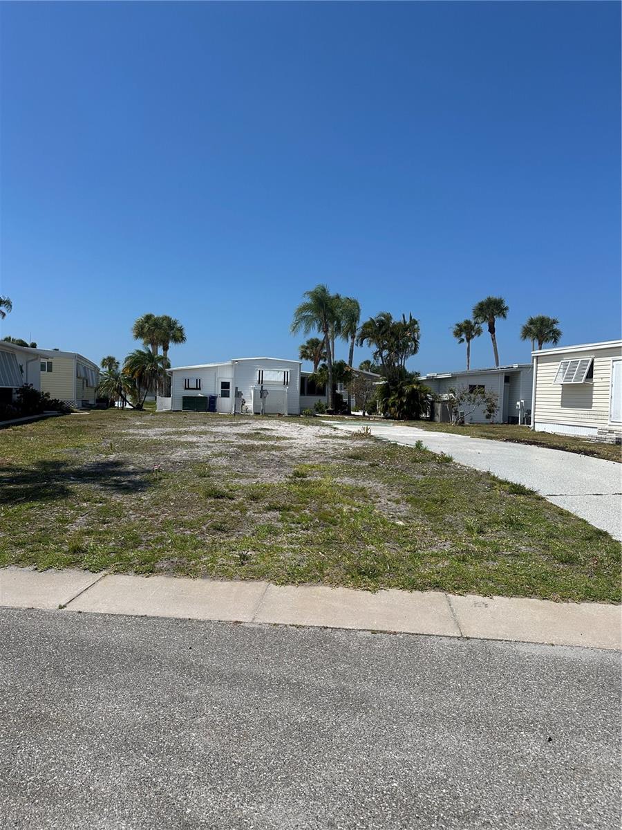 This vacant lot has been cleared and is ready for a new home! The lot is 50'x 75' and will fit most modern doublewide homes. The lot is located in Japanese Gardens, an active 55+ community.  The community features a resort style pool and hot tub, pickleball, bocce, and shuffleboard courts, library, billiards room, and a clubhouse.  The community always  has something to with many clubs and activities to keep you busy!