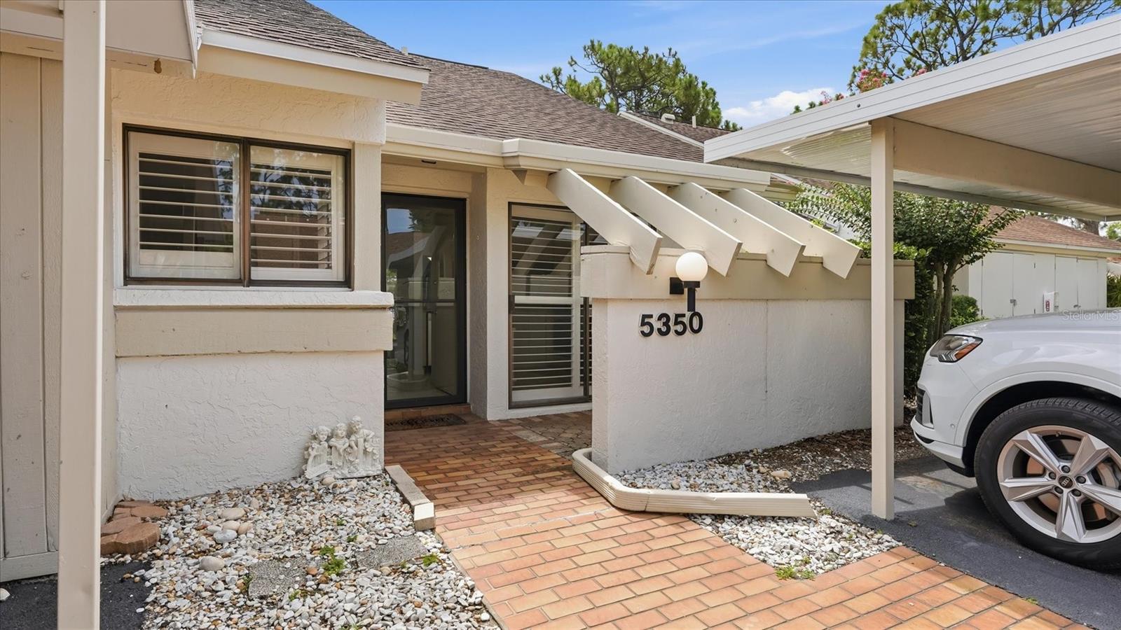 Welcome to your charming, light-filled Florida retreat at 5350 Myrtle Wood in the highly desirable The Meadows neighborhood in Sarasota. This 2-bedroom, 2-bathroom ground-floor villa offers approximately 1064 square feet of well-designed, maintenance-free living space. Tucked away in the serene Somerset community, the home blends a relaxed resort lifestyle with unbeatable everyday convenience. Spacious Open Layout. Large living room and dining room combination perfect for easy entertaining and comfortable daily living. Modern & Fresh low-maintenance vinyl plank flooring installed across the bedrooms & the living/dining areas. Equipped with dedicated laundry featuring an in-unit washer and dryer. Poolside Living: Premium location directly in front of the community pool, offering immediate backyard access for a refreshing swim. Prime Shopping & Dining: Minutes from top-tier retail, restaurants, and grocery options at the University Town Center (UTC) district. Outdoor Recreation: Located next to Nathan Benderson Park for world-class rowing, walking trails, and community events. Commuter's Dream: Quick, hassle-free access to I-75 connects you to downtown Sarasota, local beaches, and airports.