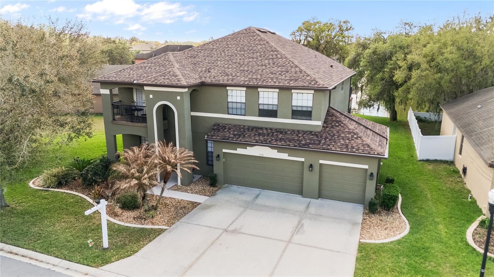 NEW PRICE! Welcome HOME Florida! Quality meets Quantity in this Expansive 4 Bed 3.5 Bath Home with almost 3600 sq feet sits on one of the LARGEST POND/ Bird Sanctuary FRONTAGE LOTS in this Gated Community of Oak Landing in MULBERRY, FL.   All of the UPGRADES throughout were added to this home at construction like  French doors, Solid  Maple Wood Cabinets/ Built in Range Hood, Granite Countertops, High Ceilings, Arched walls and Doorways, Balcony overlook and OPEN UPPER LEVEL Deck right off of the Game room/Billiard room,  Added 220 Volt Plug for an RV or Generator in the 3 CAR Garage.   Wonderful home for multigenerational LIVING with the 4 Spacious Bedrooms, 2 being set up like FULL Primary Suites!  The FULLY EQUIPPED THEATRE ( Reclining adjoined seating ensemble, BOSE Sound System, SHARP TV, MOVIE DECOR all Convey with an acceptable Offer) This Bonus Upstairs space, the OPEN FLOORPLAN, Kitchen and Family rooms, and BEAUTIFUL Formal Living and Dining rooms allow for ample room to spread out and yet find a nook of your own even while enjoying room to HOST family or friends in larger gathering spaces as well! Kitchen features A Massive breakfast Bar Island, Dining Nook, Closet Pantry storage, Glass front doors, any Chefs DREAM!!  Great VALUE for this neighborhood and all that it offers !! New Roof 2024, New AC -downstairs 3 years old. , Freshly Painted Exterior, New Sprinkler System 2025, New Gutters (2025) ONLY $160/ sq foot!!! Call to make your appointment to visit the home today!