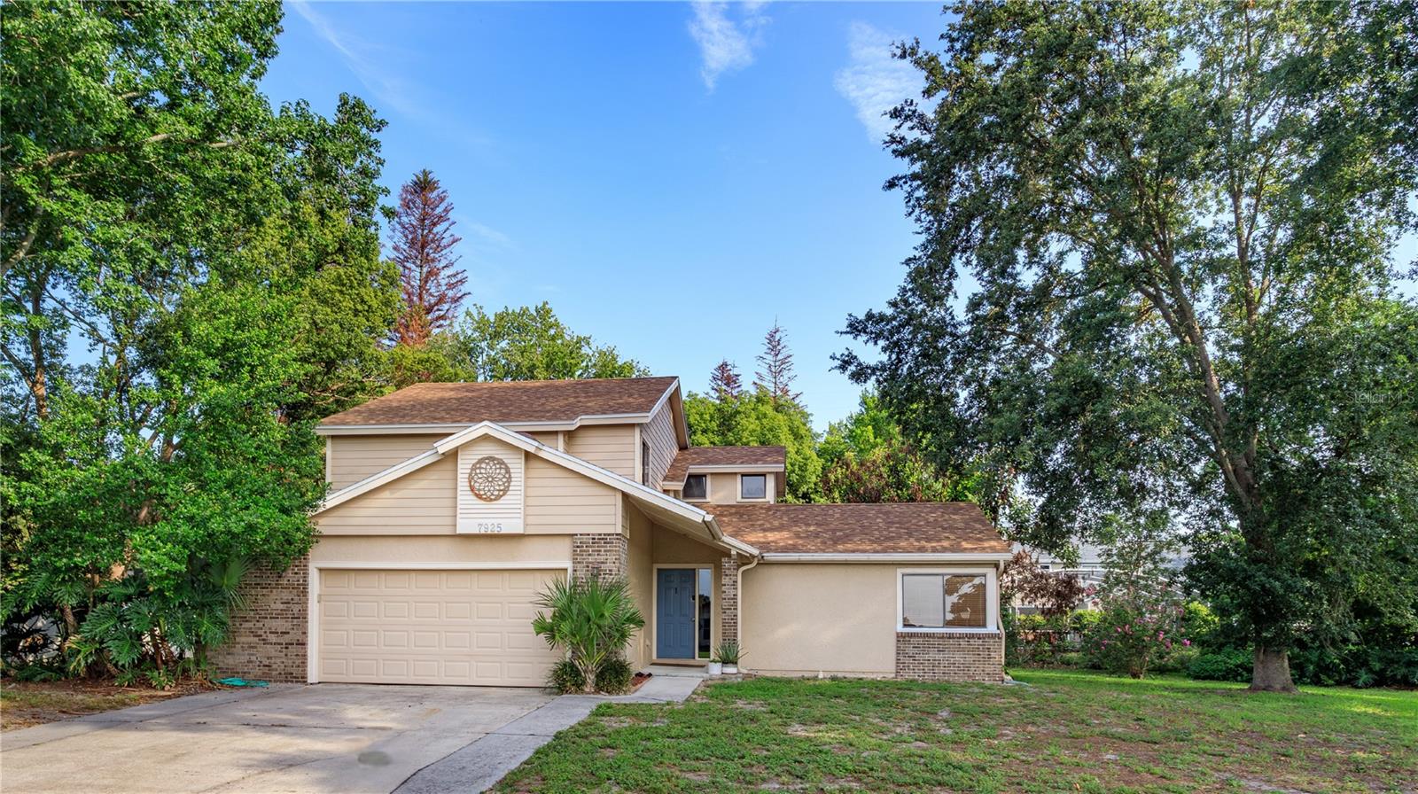 Perfectly positioned in the heart of Dr. Phillips, just minutes from Orlando's renowned Restaurant Row, Universal Orlando Resort, world-class shopping, and major commuter routes, this spacious home offers an exceptional combination of location, flexibility, and value. Featuring double primary suites, a NEW ROOF (2026), and a NEW HVAC system (2026), many of the home's biggest investments have already been made, allowing you to move in with confidence while adding your own personal style over time.

Inside, you'll find over 2,000 square feet of thoughtfully designed living space with generous room sizes, multiple gathering areas, and a floor plan ideal for multi-generational living, long-term guests, or anyone seeking the convenience of dual primary suites. The beautifully renovated main primary retreat on the second floor showcases a spa-inspired bath complete with dual vessel sinks, an oversized walk-in shower, and an impressive custom walk-in closet with built-in shelving.

The second primary suite on the first floor offers privacy and flexibility, making it perfect for extended family, visiting guests, or a private home office setup. Three full bathrooms provide comfortable accommodations for everyone.

Step outside to enjoy the oversized screened lanai overlooking a large, private backyard framed by mature trees—an ideal setting for weekend barbecues, entertaining, gardening, or simply relaxing with your morning coffee. The expansive yard offers plenty of room to create your dream outdoor oasis, including space for a future pool.

Located in one of Orlando's most sought-after areas, you'll enjoy easy access to Restaurant Row, Universal Orlando Resort, International Drive, championship golf, premier shopping, excellent dining, and Orlando International Airport. Whether you're looking for room to grow, space for multi-generational living, or simply want to enjoy everything the Dr. Phillips lifestyle has to offer, this home is ready to welcome its next owner. Come experience it for yourself.