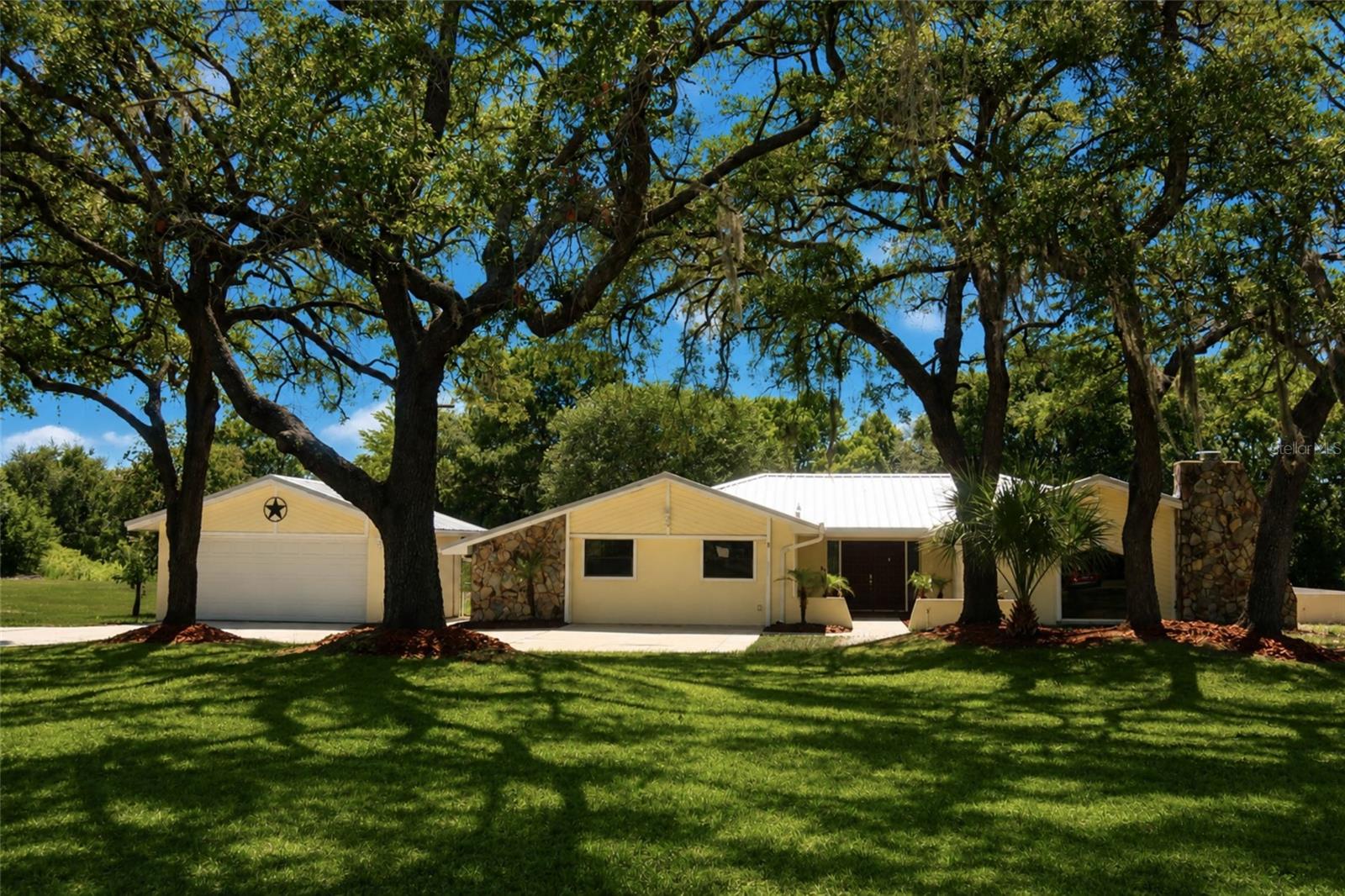 Welcome to 18923 Rolling Oak Dr in Hudson! Nestled on 1.5 acres in the desirable Rolling Oaks Estates community, this spacious 4-bedroom, 4-bathroom home offers 3,190 square feet of living space and endless potential for a new owner to make it their own. The expansive kitchen comes equipped with stainless steel appliances and opens to generous living and dining areas. Additional features including a wet bar, fireplace, and large screened-in porch create the perfect setting for hosting family and friends.

The primary suite features a his-and-hers style bathroom complete with dual vanities, two walk-in closets, and a walk-through shower connecting both sides. The second bedroom offers dual vanities, a walk-in shower, a walk-in closet, and French doors leading directly to the backyard. The third bedroom includes two closets, a private bathroom, and sliding glass door access to the screened porch, while the fourth bedroom also features two closets and its own bathroom, providing privacy and convenience for family members or guests. Additional conveniences include a detached two-car garage and a storage shed, offering ample space for vehicles, tools, and recreational equipment.

Rolling Oaks Estates is known for its oversized lots and peaceful atmosphere, providing a country feel while remaining close to everyday conveniences. Enjoy easy access to shopping, dining, and outdoor recreation, including nearby parks, nature preserves, boating, and fishing. Near US-19 and the Suncoast Pkwy, Tampa and its surrounding areas are easily accessible. Being sold as-is, this home presents a rare opportunity to own a large property and create your dream home in one of Hudson's most sought-after neighborhoods. Schedule a showing today!