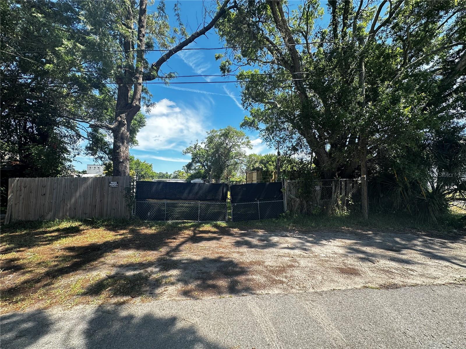 Incredible opportunity on this C-2 zoned commercial lot in Clearwater.  Per Pinellas County, C-2 zoning allows for:  "Retail, offices, auto repair, personal/business services, restaurants, hotels, wholesale/distribution, research/development, multi-family residential & recreation."  Perfect for a lawn company, tree service company, RV/boat storage, etc.  The property is fenced and has a very nice aluminum  shed that has electric to it and can easily be converted to an office.  The seller will leave double french doors that would replace the roll up door.  There's also a large storage container that will convey with the property.  Zone flood X...no flood insurance required!