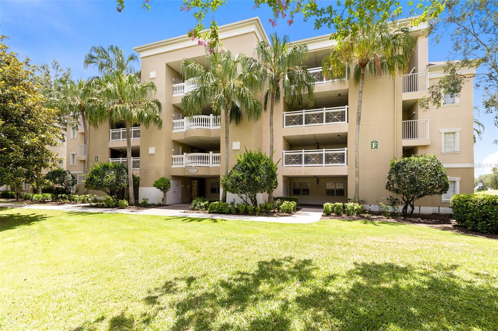 This elegantly appointed second-floor corner condominium is in one of the desirable buildings within Reunion Resort’s coveted Centre Court Ridge community, offering front-row, stadium-like views over the 12th hole of the Tom Watson Signature Course. From your south-facing private balcony, enjoy sweeping golf vistas, conservation backdrops and spectacular sunset skies. So close to the action, you’ll feel as though you’re playing alongside the fairway. Location within the resort is equally unmatched. Go outside your front door and you are directly across from the community pool, the award-winning tennis and pickleball complex, and Reunion’s miniature golf course. Just a short distance places you at the heart of the resort. including the clubhouse, Starbucks and several of Reunion’s popular dining venues, including The Chophouse, the Sushi Bar, and the 11th-floor rooftop restaurant and cocktail lounge where Disney fireworks light up the evening sky. Offered fully furnished and turnkey, this residence is in a vacation rental program with future bookings that may convey, creating immediate income potential or effortless enjoyment as a private retreat. Centre Court Ridge condominiums are known for their upgraded finishes, including granite countertops, stainless steel appliances, crown molding and tray ceilings. The thoughtfully designed split floor plan features en-suite baths for both bedrooms, providing comfort and privacy for owners and guests alike. An active Reunion Resort membership conveys, offering the option for full access to the resort’s world-class amenities, including multiple pools, private water park, golf, tennis, dining and shuttle service throughout the community. Within Reunion’s 2,300-acre gated resort, just six miles from Walt Disney World and within easy reach of Orlando International Airport, this is an exceptional opportunity to own in one of Central Florida’s premier luxury resort communities.