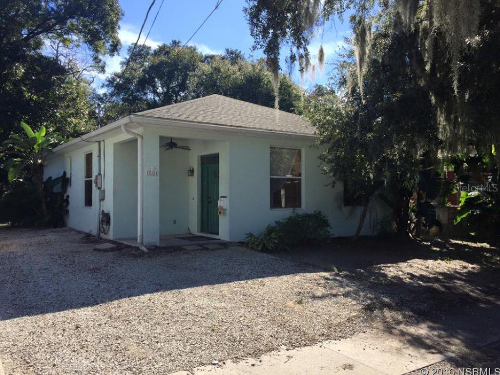 Shaded by a large Live Oak, this concrete block home build in 2005 is full of Southern Charm.  Features include a spacious open floor plan, stainless appliances, custom solid wood hickory cabinets, maple trim, natural cherry wood shutters, indoor laundry, and newer fixtures.  The large master bedroom has a huge walk-through closet and a large full bath.  is located just blocks from the river and historical downtown New Smyrna Beach.  The smaller lot size means no grass to mow so you can enjoy maintenance free living. ;Water: City