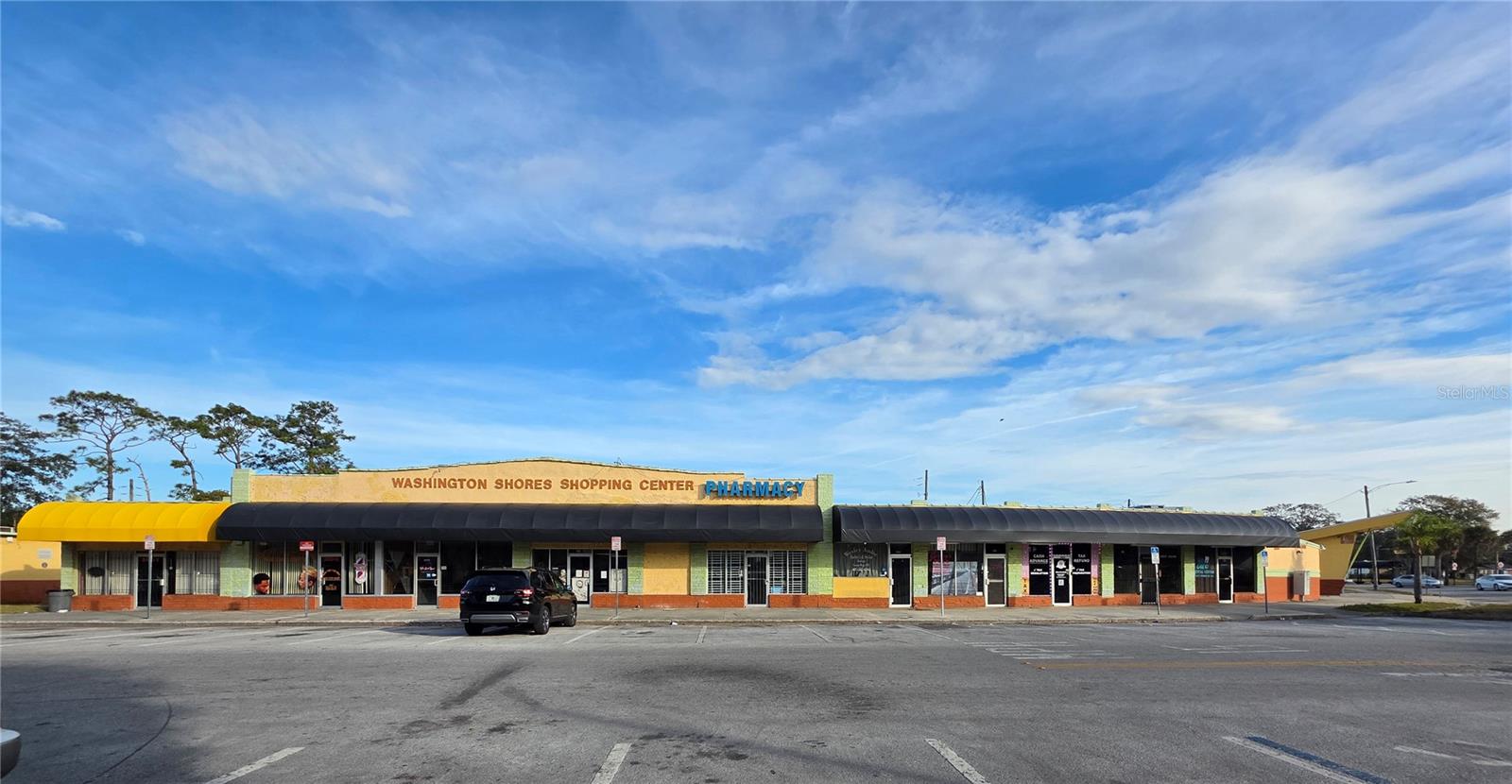 Offered for the first time! Located in the historic Washington Shores neighborhood, this freestanding retail building presents a prime  opportunity with strong visibility, accessibility, and established community presence. The property currently supports a diverse mix of successful onsite businesses, including a convenience store, barbershops, pharmacy, nail salon, Taiwanese restaurant, car wash/detail shop, and the well-known WS Seafood Fish Market, totaling 13 units. Positioned for future growth, the site offers exceptional potential for redevelopment or repositioning into a vibrant mixed-use destination or community social hub. Its existing tenant mix and steady foot traffic provide immediate functionality while allowing investors and entrepreneurs the flexibility to execute a long-term vision. Whether you are seeking a stable income-producing retail asset, neighborhood commercial center, or redevelopment opportunity in a growing corridor, this property offers the foundation and location to bring that vision to life.