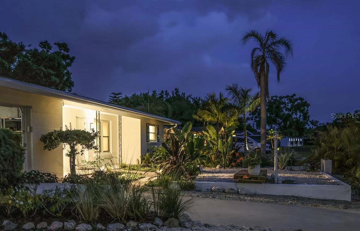Architect-Designed Masterpiece of Indoor – Outdoor Living………. this meticulously crafted residence sits on a prime Sarasota lot of nearly 10,000sq ft. in a neighborhood atmosphere that is soft and warm and children play everyday. The design embodies a Garden – Architecture Integrated Layout; A concept known as The MODERN - BOHEMIAN style and is devoted to creating meaningful interactions between the built environment and the surrounding landscape by fusing the warmth, nature, and free spirit of Bohemian (Boho) with the simplicity, sophistication, and functionalism of Modern (Modern) style. It is a blended aesthetic that seeks a relaxed, personalized atmosphere while maintaining visual neatness and a sense of refinement….. At first glance, one sees a solid block construction home in a very quiet and established community. (With City Water and City Sewer, No Deed Restrictions, No CDD Fees, Not in a Flood Zone and No pesky HOA.)…. Secondly, one sees that the luxuriously opulent garden wraps all around the home, giving it an exotic feel as well as complete privacy….. Step into the home through the front door and one sees a brand new open kitchen with a ceramic and stone backsplash, quartz countertops and island top, all new appliances and an engineered wood floor throughout the home…. The living/dining room opens fully to the patio/yard through window doors, transforming the entire area into an outdoor extension ideal for gatherings…..The master bedroom and the second bedroom each boast en-suite bathrooms and have private sliding door access to the Bohemian Garden, where the backyard greenery seems to be reaching into the rooms in a subtle way, which makes them true Garden Suite bedrooms…..There is a third bedroom and a third full bath as well as a garage with a new washer, a new dryer and new storage racking…..A concrete parking pad suitable for a car, boat or trailer has been added right next to the garage….Close to Downtown Sarasota, I-75, the airport and shopping. Please see the attached pictures with descriptions to get a better understanding of the features of this home.....and Please look at the Virtual Tours for some brilliant views of this wonderful offering.