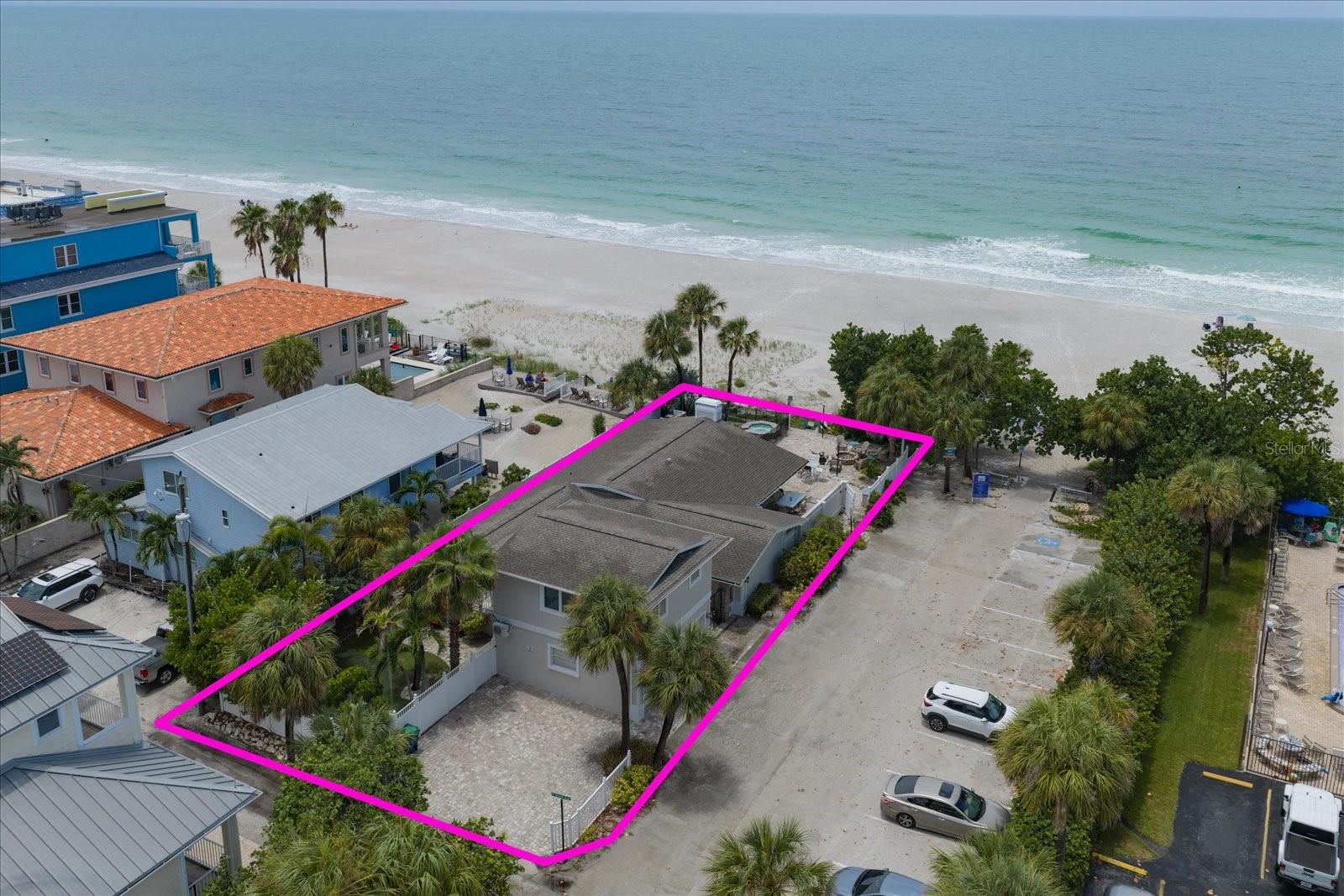 Rare Gulf-front opportunity in Indian Rocks Beach! This exceptional property offers multi-family zoning and features a 3BR/2BA main residence plus a detached 1BR/1BA apartment, offering flexibility as a full-time home or income-producing investment. The open floor plan showcases a spacious chef’s kitchen with two islands, stainless-steel appliances, a wine refrigerator, and seamless flow into the family room with a stone fireplace, custom built-ins and breathtaking Gulf views. A formal dining room is perfect for entertaining. Outside, enjoy your private beachfront oasis with an outdoor kitchen, pool, spa, putting green, and firepit. The split-bedroom design includes a luxurious primary suite with a spa-like bath and generously sized guest rooms, while the detached 1BR/1BA apartment provides additional living space for guests or rental income. Just steps from local restaurants and shops, and a short drive to the mainland via the Belleair Causeway, this is coastal living at its best.