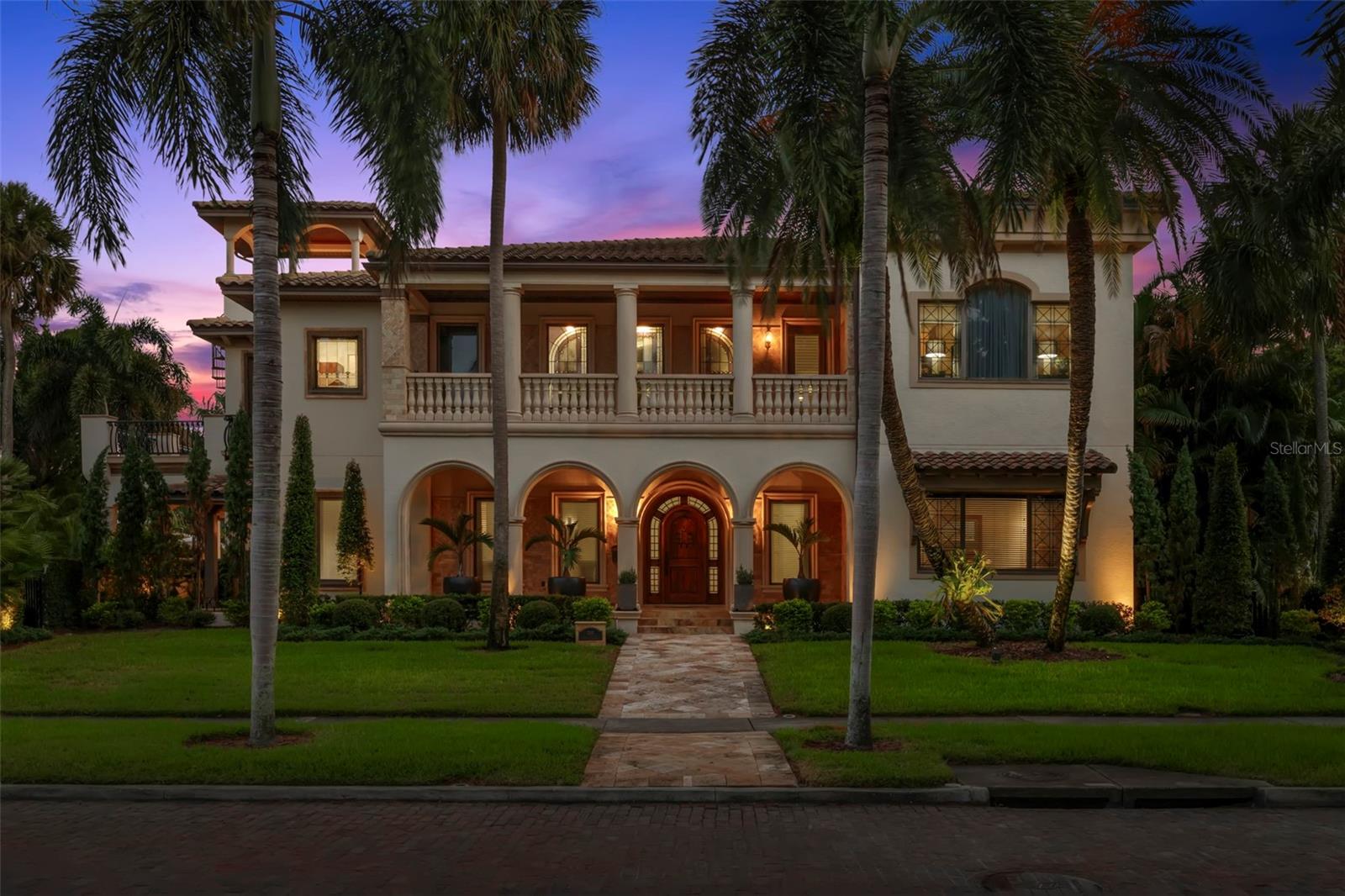 Situated in the prestigious Old Northeast neighborhood of St. Petersburg, this meticulously renovated custom-built estate is the epitome of luxury and location. Just steps from North Shore Park and a short walk to Beach Drive’s renowned shops, restaurants, and waterfront, this home offers an unparalleled blend of elegance and convenience. Positioned on a rare 126 x 110 double lot, this stunning property boasts over 5,450 square feet of living space, featuring 5 bedrooms, 5 full bathrooms, and 2 half bathrooms.The open floor plan downstairs flows into the grand living and dining areas with soaring 12-foot tray ceilings, Brazilian teak hardwood floors, custom mahogany doors, a private study and a guest suite with ensuite bath. The gourmet kitchen, designed by Michael Bright, is a chef’s dream with high-end Miele and Liebherr appliances, a 6-burner gas range, steam oven, large island, and a butler’s pantry. Upstairs features a split floor plan, 10-foot ceilings and multiple terraces. The primary suite is a true retreat, complete with a spa-like ensuite, soaking tub, large walk-in shower, dual vanities, a coffee bar with mini-fridge and two expansive custom closets. A private elevator leads to 3 additional bedrooms each with ensuite baths, and a spacious bonus room with a half bath, 3 full-size Murphy beds and built-ins perfect for movie nights, gaming or unwinding at the end of the day. The outdoor spaces are equally impressive, featuring multiple terraces with views of Tampa Bay, a Pebble Tec pool and spa, pool bath and shower and a fully equipped  outdoor kitchen perfect for entertaining. The custom-designed 3-car garage includes a car lift for a fourth vehicle, workbench, tool cabinets, and ample storage. Additional highlights include impact-resistant windows, an 18KW generator, and a state-of-the-art home security system. This estate offers the finest in luxury indoor/outdoor Florida living, perfectly complemented by its prime Old Northeast location. Furnishings are available for purchase and convenience.