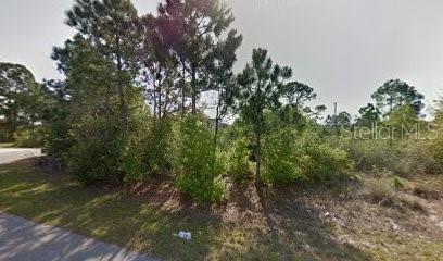Nice residential corner lot in Port Malibar. Well/Septic area