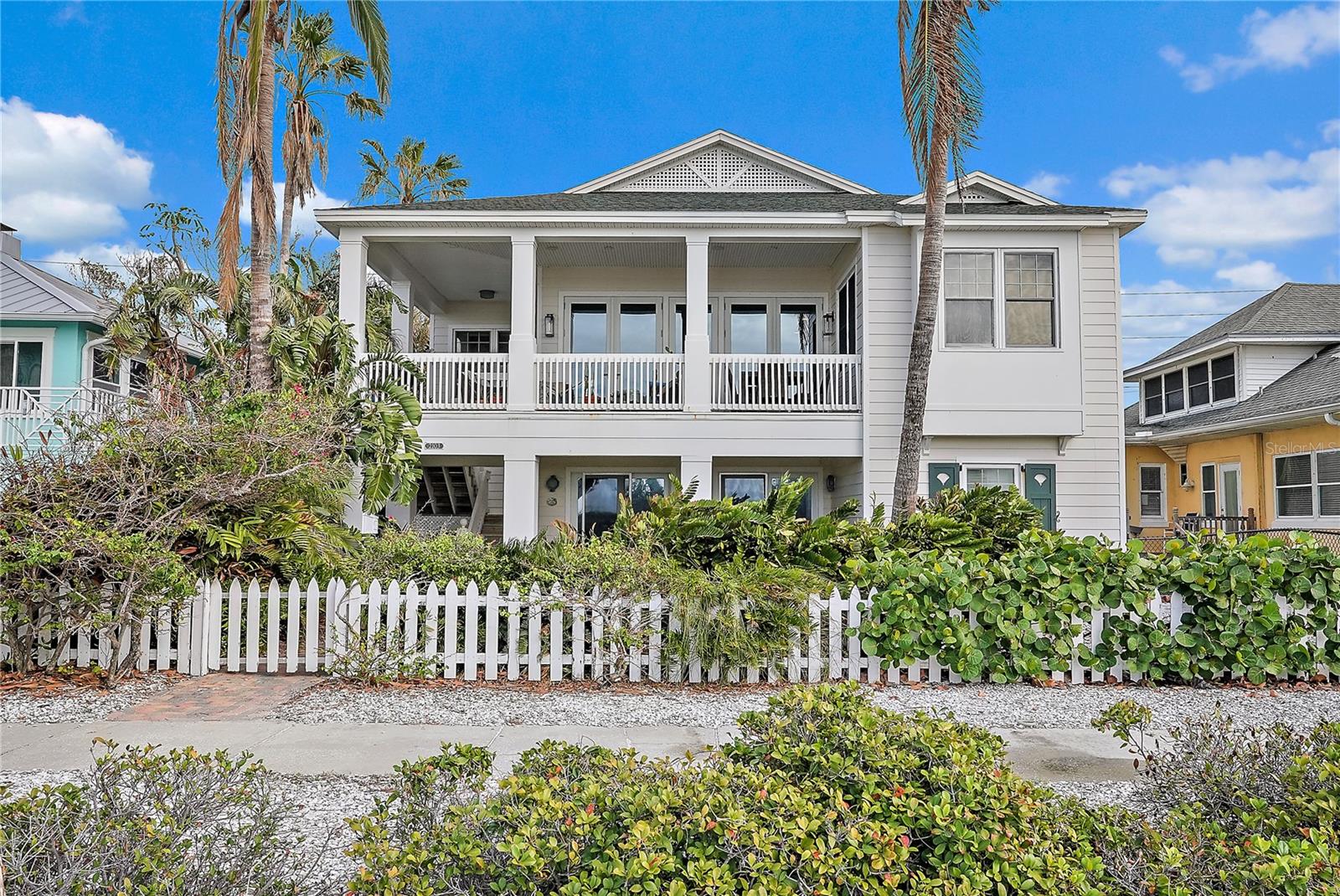 Welcome to your dream coastal cottage in Pass-a-Grille where luxury meets breathtaking natural beauty every day. This elevated home offers panoramic views of the Gulf of Mexico from nearly every room, ensuring that you're always connected to the serene sights and sounds of the ocean.  Step across the street to what feels like a private beach with white sugary sand and blue green waters. Stroll the beach and community offering restaurants, boutiques, bars and cafes. Once inside, discover an open floor plan built in 2004 with high ceilings and flooded with natural light that creating an airy and inviting atmosphere. The spacious rooms (indoors and out) are designed for both comfort and style, providing ample space for relaxation and entertaining. Sip wine while enjoying the sunset every evening from your front porch living space or dine al fresco with friends at the outdoor table.  The gourmet kitchen is a chef's delight, featuring gas cooking and top-of-the-line appliances, perfect for preparing meals while enjoying the stunning vistas.  For car enthusiasts or those in need of extra storage, this property boasts a three-car garage plus an additional two-car garage, an absolute rarity along the beaches, offering plenty of space for vehicles and hobbies. The large laundry room is equipped with abundant storage, making organization a breeze.  This home is thoughtfully designed with future possibilities in mind, including space to add an elevator for easy access to all levels. Additional storage space on the first floor ensures that you have room for all your belongings.  Experience the ultimate in coastal living with this exceptional property on Gulf Way, where every detail is crafted to enhance your lifestyle and provide a sanctuary by the sea.  No water intrusion in either of the recent storms.  High and dry.