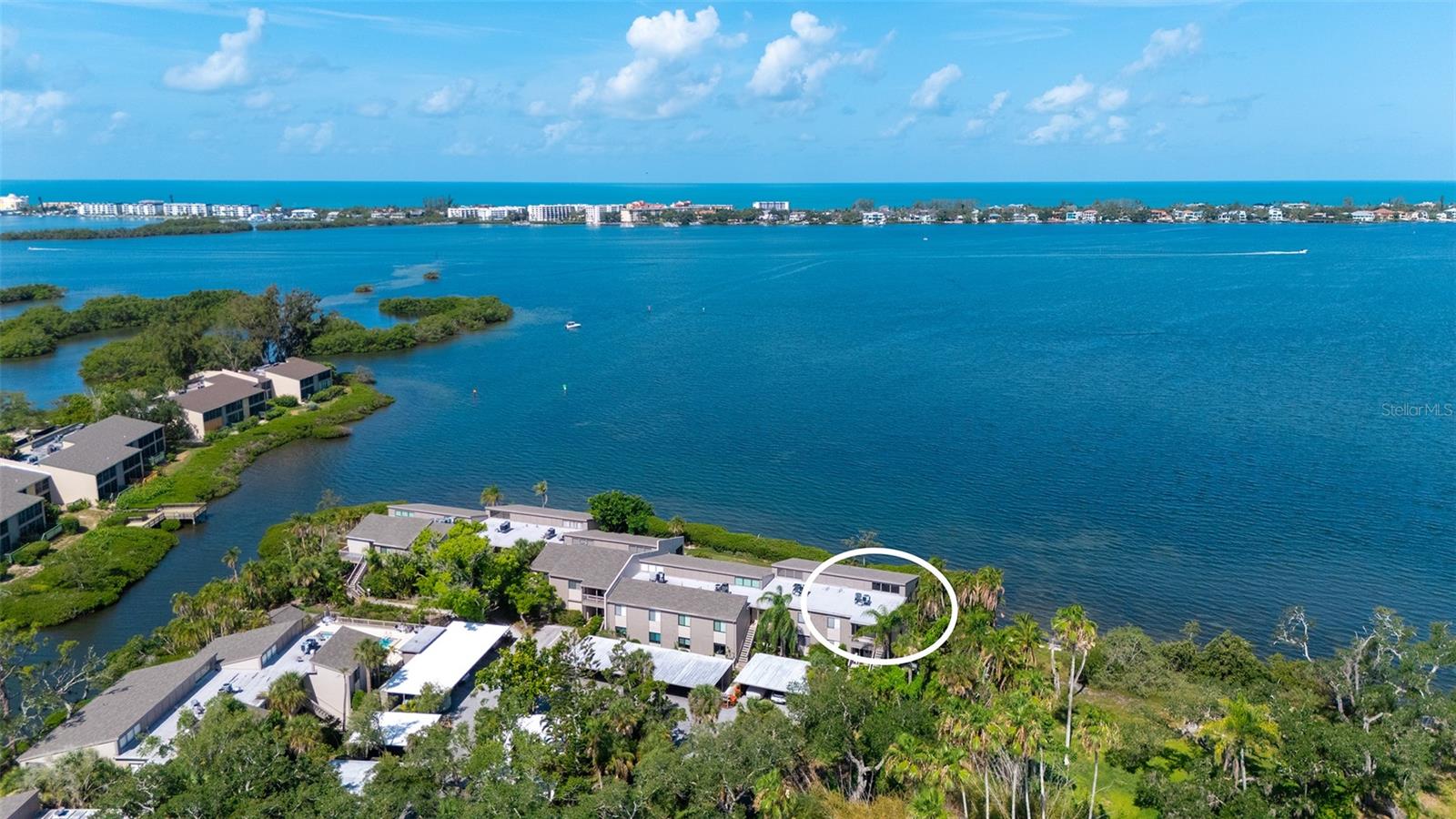 Gorgeous Bay front condo, with the best view in Pelican Cove! You will love this very private 2 bedroom/2 bathroom with its own staircase to entrance and story book views from every window. The glassed-in large lanai overlooks Sarasota Bay and to the side 2 oversized windows in living/dining room open up to a beautiful Nature preserve. The east-west orientation is the one you want to have, it offers an abundance of natural light all day and incredible sunsets over the water. Cathedral ceilings, clerestory windows, steps to swimming pool and just around the corner to yacht basin, yes this is a one-of-a-kind condo. Light and bright Bedrooms are separated by a long hallway and the two bathrooms, so privacy is ensured. Kitchen has maple cabinets with large pot drawers and under cabinet lighting, granite counters, double stainless under-mount sink, stainless steel appliances & track lighting. Bathrooms have vanities with granite tops and clear frameless shower doors, AC 2020 & Water heater 2017.
Pelican Cove is one of Sarasota’s most popular gated, waterfront communities; resort style living in a tropical, Old Florida setting on 75 acres along Little Sarasota Bay. Enjoy the 6 swimming pools, 4 tennis courts, private Marina with 87-boat slips, sailboat water, kayaking, canoeing, and fishing pier. Three clubhouses, lighted tennis and pickleball courts, shuffleboard, basketball, dog walking areas, and over 5 miles of walking trails and boardwalks. For creative minds enjoy the many clubs and art studios, a pottery and sculpture room and woodwork shop. Visit the classes the Pelican Cove University is offering, concerts with jazz, rock, folk or classical music and other cultural events. Pelican Cove is a well-managed community with on-site management. Centrally located with easy access to nearby beaches and a short drive to everything Downtown Sarasota has to offer. Shopping is a breeze with Sprouts, Costco, soon to open Trader Joe’s and Whole Foods or enjoy dining out in a variety of nearby restaurants. Don't delay on this one, Call today for a private showing.
