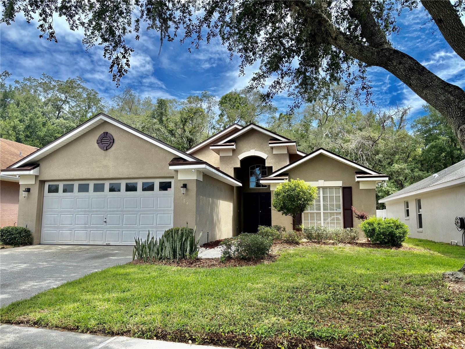 OVIEDO!  Great location just minutes from top-rated elementary, middle and high schools, UCF, and easy access to the 417.  Boasting great curb appeal with mature landscaping and a privacy-fenced back yard, this house will not disappoint when you enter.  You will have a large living and dining combo, flowing into a kitchen-breakfast area-family room.  The kitchen is well-appointed with an abundance of cabinets, plus TWO reach-in pantries and a very convenient laundry closet with washer and dryer.  The kitchen also offers a breakfast/serving bar and the dinette features a charming window seat in the bay window.  This is a split-bedroom plan, with the two secondary bedrooms sharing a bath and a linen closet near the front of the house, and the master bedroom with huge en suite bath on the back of the house for privacy.  The bath has both a step-in shower and a jetted soaking tub, as well as separate dual vanities and a private water closet.  There are ceiling fans in both living areas and in all three bedrooms, which will help keep power bills lower.  Architectural details such as volume ceilings, arched doorways and plant ledges enhance the decor, and clerestory windows bring in natural light.  There is tile flooring for easy maintenance.  Call for your private showing today.  AVAILABLE FOR QUICK MOVE-IN!